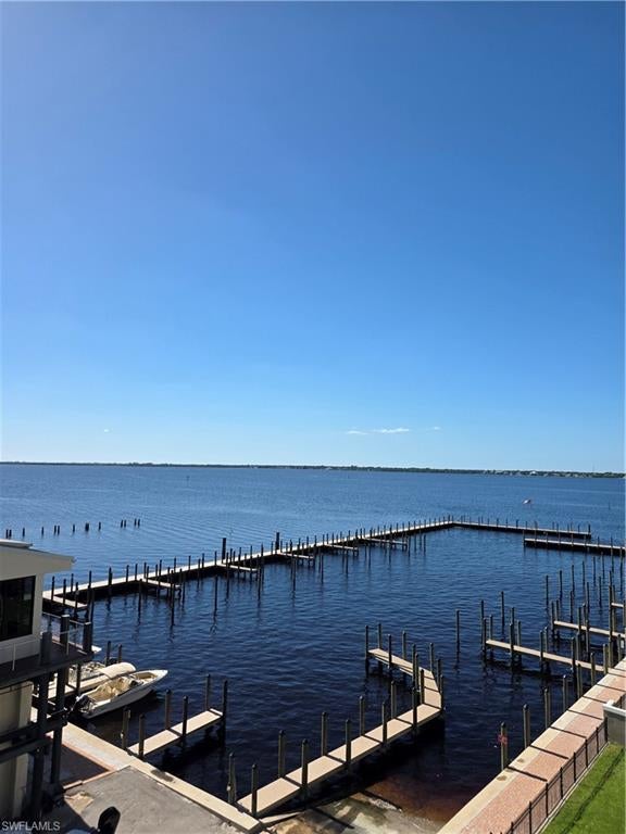 This is a end, corner unit that has been updated and ready to move in. Newer KitchenAide and Jenn-Air appliances.  Incredible Southwest view of the Marina and Caloosahatchee River, Covered parking and community pool.