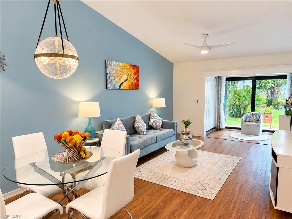 Welcome to this garden home oasis in Naples, where thoughtful updates, privacy and effortless indoor outdoor living come together beautifully. This well designed 2 bedroom, 2 bath residence features Cortec luxury vinyl flooring throughout, Carrera marble bathroom floors, an updated kitchen with granite countertops, stainless steel appliances and an alkaline water filtration system. Vaulted ceilings enhance and create an open, airy feel throughout the main living area. Hurricane impact windows, doors and a hurricane rated tile roof installed in 2022 provide added storm protection and peace of mind. Enjoy a newly screened front porch and panoramic rear screen enclosure offering unobstructed views of the lush garden and tranquil lake. Motorized window treatments, newer ceiling fans and distinctive designer lighting add comfort, character and style throughout the home, while a private storage unit and covered one carport complete this exceptional Naples retreat. Ideally located just 4 miles from Fifth Avenue South, this tranquil Naples retreat offers easy access to boutiques, galleries, acclaimed dining, waterfront attractions and beautiful beaches, placing you just minutes from the best of Naples.