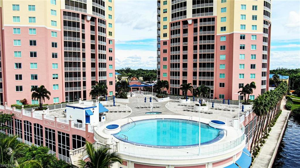 Experience TRUE RESORT-STYLE LIVING in this LUXURIOUS 4th-floor END-UNIT condo on the RIVER PROMENADE in the highly desirable RIVIERA in DOWNTOWN FORT MYERS. Enjoy an exceptional lineup of HIGH-END AMENITIES including GATED entry, concierge services, security, infinity-edge pool & spa overlooking the CALOOSAHATCHEE RIVER (open until 10 PM), fitness center, pickleball & tennis courts, dog park, theater, library, billiards, BBQ & picnic areas, conference rooms, extra storage & one ASSIGNED COVERED PARKING SPACE. HOA includes cable, internet/Wi-Fi, water, and trash; ONLY electric is separate, offering outstanding value & low-maintenance living. Located just MINUTES from vibrant FORT MYERS RIVER DISTRICT w/ dining, shopping, entertainment, nightlife & cultural events. Seasonal FREE TROLLEY provides easy access to downtown attractions & nearby Publix. Enter via PRIVATE or community elevator into a SPACIOUS FOYER. This sought-after residence features the LARGEST FLOOR PLAN w/ 3 BEDROOMS + DEN & 2 BATHS. BRAND NEW WATERPROOF LUXURY VINYL PLANK FLOORING throughout - NO CARPET! Freshly painted interior w/ crown molding enhances the main living areas & primary suite. BRIGHT, OPEN living room flows seamlessly to a WRAP-AROUND SCREENED BALCONY showcasing NORTH RIVER VIEWS & EAST CITY VIEWS; perfect for relaxing, entertaining, or enjoying SUNRISES over the WATER. The desirable SPLIT FLOOR PLAN offers TWO SPACIOUS ENSUITE PRIMARY SUITES with large/walk-in closets & PRIVATE SLIDING DOORS to the balcony, creating a rare and versatile layout ideal for full-time residents, seasonal owners, or multigenerational living. Third bedroom offers flexibility for guests, office, hobby room, or additional sleeping space. UPGRADED KITCHEN features QUARTZ countertops and backsplash, BRAND NEW CUSTOM WHITE SHAKER CABINETS, newer STAINLESS-STEEL GE PROFILE APPLIANCES, and breakfast/cocktail bar seating, with adjacent dining area for effortless everyday living and entertaining. DEN/OFFICE leads to IN-UNIT LAUNDRY with MAYTAG FRONT-LOAD WASHER & DRYER. Additional upgrades include AMANA 16-SEER HVAC (2020) with transferable warranty and WATER HEATER (2023), giving buyers valuable peace of mind and reducing immediate replacement concerns. Convenient access to PARKING and STORAGE adds everyday ease. This MOVE-IN READY condo is an excellent option for a primary residence, winter retreat, or income-producing property with FLEXIBLE RENTAL POLICY allowing up to 12 leases per year with 30-day minimums. EASY ACCESS to US-41 and I-75, plus close proximity to PUNTA GORDA and SWFL INTERNATIONAL AIRPORTS for convenient travel to TAMPA, ORLANDO, and MIAMI. In today’s market, finding a spacious UPDATED END-UNIT with major system updates, generous HOA inclusions, resort amenities, rental flexibility, and a prime DOWNTOWN WATERFRONT location is increasingly rare. Don’t miss this opportunity to own in one of FORT MYERS’ most sought-after waterfront communities, schedule your private showing today!