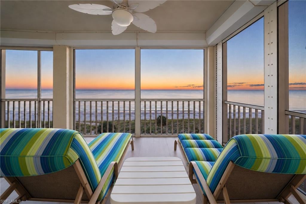 Front-row sunsets. Direct beach access. A wraparound screened lanai that makes the Gulf part of everyday life. This one-of-a-kind three-bedroom, three-bath beachfront residence at Barefoot Beach Club offers 2,003 square feet under air in an end-unit setting on the southern end of the building and directly on Barefoot Beach, an exceptional place to arrive, unwind and stay awhile. Beautiful wood ceilings, a fireplace and elegant plantation shutters throughout create a distinctive coastal interior, with natural light and a soft palette that complement the waterfront setting. Open the doors to the lanai for sunset cocktails, dinner with friends or a quiet morning with the beach below. Its wraparound design provides generous outdoor living space and multiple vantage points to enjoy the shoreline. The community clubhouse is immediately next door, placing the resort-style pool, fitness center and social events conveniently close. Three bedrooms and three full baths provide comfortable accommodations for visiting guests, while under-building parking and a separate storage room add practical convenience. Furnishings are negotiable, offering flexibility to make the residence your own. Whether you envision a seasonal escape or a full-time Gulf-front home, 257 Barefoot Beach Boulevard #404 brings together the features that define a Southwest Florida beach lifestyle, such as direct beachfront living, sunset views, spacious indoor and outdoor gathering areas, and amenities nearby. Convenient access to Southwest Florida International Airport (RSW) makes returning to your coastal retreat easy, with Bonita Springs and Naples dining, shopping and entertainment rounding out the experience. Schedule your private showing and experience the Gulf views, beachfront setting and unforgettable sunsets that could soon be part of your everyday life.
