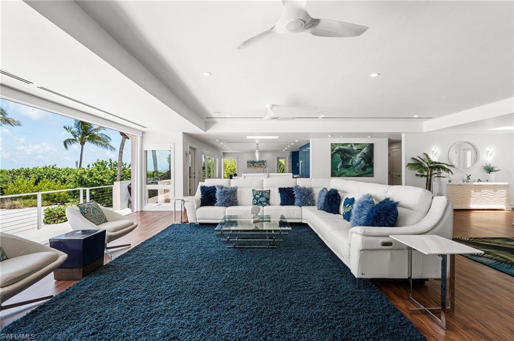 Experience the ultimate in beachfront living at 4577 Waters Edge Lane, a beautifully renovated four-bedroom, four-bath residence perfectly positioned along the pristine shores of Sanibel Island. Offering breathtaking Gulf views, direct beach access, and an exceptional blend of luxury and coastal elegance, this home captures everything that makes island living extraordinary.

Designed to maximize natural light and showcase the stunning waterfront setting, the home features soaring ceilings, skylights, and an open-concept floor plan that seamlessly connects indoor and outdoor living spaces. The thoughtfully designed kitchen is a true showpiece, featuring custom blue cabinetry, quartz countertops throughout, and premium Thermador appliances, creating a space that is both functional and visually striking.

The main living area is designed to fully embrace the beachfront lifestyle, featuring expansive impact-rated accordion glass doors that open completely to the lanai, creating a seamless transition between the interior living space and the breathtaking Gulf views beyond. Whether entertaining guests or simply relaxing at home, the disappearing wall of glass invites the sights, sounds, and ocean breezes of Sanibel's shoreline directly into the home.

Each of the four bedrooms offers comfort and privacy, while all four bathrooms were beautifully remodeled in 2025 with sophisticated finishes and timeless coastal design. Impact-resistant doors and windows throughout provide peace of mind while framing spectacular views of the Gulf and surrounding tropical landscape.

Major updates include a new roof, air conditioning system, and water heater, all installed in 2022, allowing for worry-free ownership. Every detail has been thoughtfully updated to enhance both beauty and functionality.

Whether enjoying morning coffee with the sound of the waves, hosting sunset gatherings on the lanai, or taking a few steps down to the sand, this exceptional beachfront retreat offers the very best of Sanibel Island living. Rarely does a home combine modern updates, luxury finishes, and direct beachfront access so effortlessly in one extraordinary property.