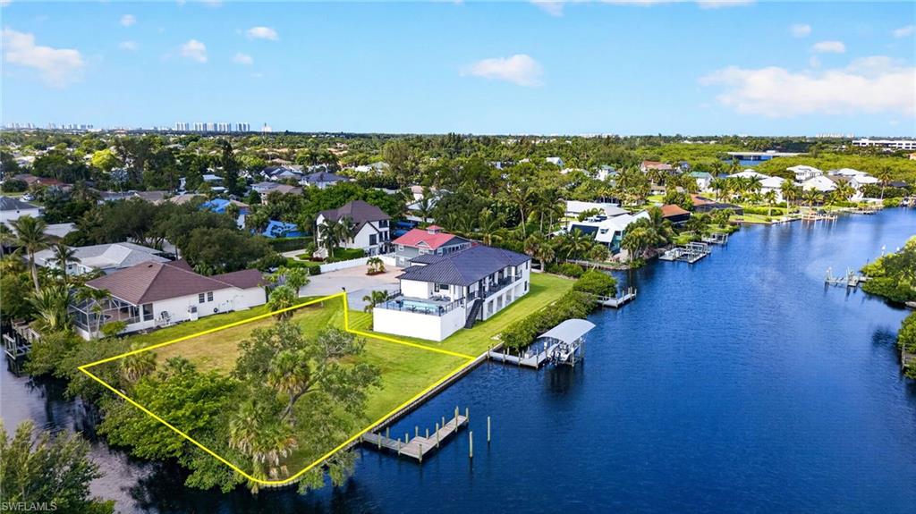 One or more photo(s) has been virtually staged, AI generated or rendered.  Bonita Springs Imperial River Gulf Access Homesite – Imagine waking up every morning with the Imperial River outside your window. This rare double-waterfront homesite gives you the opportunity to build the Southwest Florida home you've always imagined. Rare corner homesite with frontage on both the Imperial River and a private canal, offering direct Gulf access just minutes from open water. Build the custom waterfront home you've always envisioned and enjoy panoramic water views from multiple angles.

Cruise downstream to the Gulf of Mexico for world-class fishing, boating and beach days, or head upstream to explore the scenic Imperial River. By boat, bike or on foot, you're just moments from vibrant downtown Bonita Springs, one of Southwest Florida's fastest-growing destinations for waterfront dining, live music, art shows, Movies in the Park, festivals and year-round community events.

The City of Bonita Springs continues investing in the area with expanded parks, new pedestrian walkways, recreational amenities and a splash pad planned near the historic banyan tree. Opportunities to own a corner homesite with frontage on two waterways are exceptionally rare, making this an outstanding opportunity to create a one-of-a-kind waterfront estate.

By car, you're just minutes from Bonita Beach, Coconut Point, Mercato, world-class shopping and dining, downtown Naples (approximately 20 minutes), RSW International Airport (approximately 30 minutes) and FGCU (approximately 25 minutes). This thriving waterfront neighborhood has become one of Southwest Florida's most exciting destinations. Bring your vision, bring your boat and start living the Florida lifestyle you've been dreaming about. All measurements are approximate. AI illustrations may have been used.