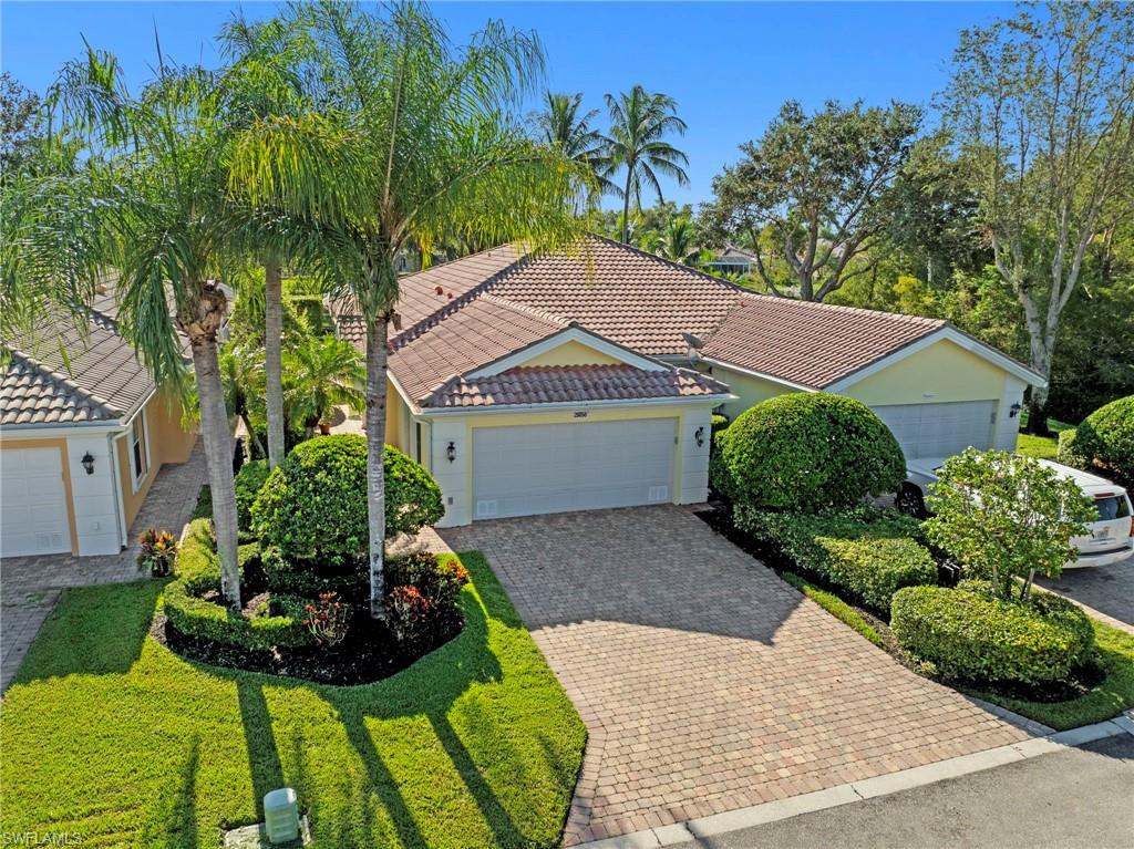 This thoughtfully updated Capri model is your cheerful escape to paradise with coastal charm. Inside, you'll find freshly painted interiors, and the house is beautifully maintained sparkling clean. The lanai offers a refreshing newer pool overlooking a peaceful lake. Close to everything in the community. Hurricane shutters for your protection. Reworked great room wall unit customized and provides valuable storage everyone needs. No carpet all tile. Divosta built with poured concrete & rebar construction. Village Walk amenities include bocce, and 3 pickle ball courts, 8 lighted tennis courts, 24/7 fitness center, resort and lap pools. Even more: car wash, gas station, restaurant, ice cream shop, bagel shop, hair salon and post office. Snap pictures of gorgeous birds as you ramble over miles of pathways & enjoy the beautiful butterfly gardens. Located in the heart of SWFL, close to Bonita Beach, dining, shopping, RSW Airport, and the upcoming “Midtown at Bonita.” This is the Capri to come and see!