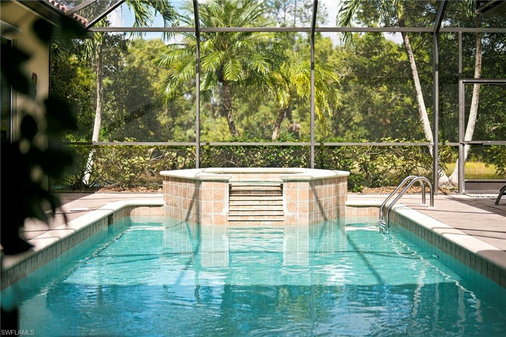 A Private Naples Retreat with Peaceful Water and Preserve Views – Imagine enjoying your morning coffee surrounded by lush tropical greenery, tranquil water views, and the rare feeling of complete privacy, all just minutes from the heart of Naples. Tucked away in a particularly peaceful setting within the gated community of Briarwood, this beautifully maintained, turnkey furnished 4-bedroom, 3-bath residence offers approximately 2,328 sq. ft. of comfortable living space and an exceptional indoor-outdoor Florida lifestyle. With no neighboring homes overlooking the rear outdoor living area, the spacious screened lanai feels like a private tropical retreat, featuring a sparkling solar-heated pool, spa, covered outdoor kitchen, alfresco dining area, and plenty of space to relax or entertain. Inside, a generous, thoughtfully designed floor plan provides comfortable living and welcoming spaces for family and guests, complemented by valuable improvements including a 2022 Trane A/C system, updated Pentair pool equipment, Samsung kitchen appliances, and convenient smart-home technology. Briarwood offers an appealing combination of gated security, low community fees, two community pools, tennis, pickleball, basketball, volleyball, and a playground, with convenient access from both Livingston Road and Radio Road. Just approximately four miles from downtown Naples and Fifth Avenue South, the home places beautiful Gulf beaches, exceptional dining, shopping, golf, and everyday conveniences within easy reach. Equally appealing as a full-time residence, seasonal getaway, or investment property, the home offers an established rental history and existing long-term tenants interested in continuing their tenancy, creating an attractive opportunity for buyers considering rental income today and personal enjoyment in the future, subject to existing lease terms and community regulations. A wonderful combination of privacy, generous living space, outdoor enjoyment, and one of Naples' most convenient locations.