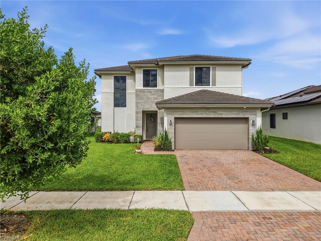 Welcome to 5047 Penella Avenue, a beautiful two-story home offering 4 bedrooms, 3 bathrooms, a 2-car garage, and extended rear lanai. Thoughtfully designed for both everyday living and entertaining, this home features a desirable floor plan with one bedroom and a full bathroom conveniently located downstairs, while the remaining bedrooms are upstairs. Step outside to the back lanai and enjoy a peaceful enclosed view—an ideal setting for morning coffee, outdoor dining, or relaxing at the end of the day. The spacious two-story layout provides plenty of room for family and guests while offering privacy between the living spaces and bedrooms. Located in the vibrant master-planned community of Ave Maria, residents enjoy an exceptional lifestyle with resort-style amenities, parks, walking and biking trails, sports courts, playgrounds, a water park, and convenient access to the Town Center. The Town Center offers shopping, dining, services, and everyday conveniences, while the community's events and activities create a welcoming small-town atmosphere.