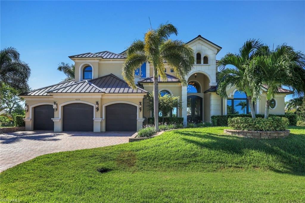 A RARE WATERFRONT MASTERPIECE by KOOGLER HOMES — Ultimate Luxury, Seven Islands location and unparalleled Boating Access. No Bridge/No Locks Direct Gulf-Access Estate w/ unobstructed panoramic views.  3 beds w/ private en-suites plus flex spaces, including private office/den, exercise room and spacious Bonus/Entertainment Room.  Southern rear exposure with majestic western sunset views!  Exceptional waterfront living in this remarkable custom residence situated on an oversized three-lot cul-de-sac parcel overlooking beautiful Wazee Lake, 3 intersecting canals, including spreader canal w/ mangroves. 4,317 sq' of living area, sophisticated architectural and custom trim details w/ 9" base, large crown throughout w/ custom window and slider surrounds.  The dramatic Great Room features soaring 20–25-foot ceilings, dazzling chandeliers, pecky cypress ceiling and a striking cast-stone fireplace. Expansive glass sliders create a seamless transition between the elegant interior and the outdoor entertaining areas. Premium level granite countertops throughout w/ upscale custom wood cabinetry and a kitchen island with seating for four complement the home's inviting entertaining spaces, while a sunken wet bar adds a distinctive touch.  Open kitchen w/ huge pantry, Bosch appliances.  The spacious FIRST FLOOR Primary Suite enjoys beautiful water views and a luxurious bathroom with a jetted tub and multiple shower heads. Custom hand-hewn wood flooring, travertine tile, wood-accented ceilings, 8' solid core doors and approximately 10-foot ceilings throughout the remaining main and upper levels reflect the home's thoughtful design.  The SECOND FLOOR offers a versatile bonus room with a wet bar, microwave, and refrigerator, opening onto an expansive covered veranda and an approximately 490-square-foot sun deck w/ views of Wazee Lake, the spreader canal, and distant mangroves, along with spectacular sunrises and sunsets.  Outdoor living w/ TV, custom kitchen and fireplace w/ heated saltwater pool, spa, cascading waterfall with bubblers, outdoor shower, and exterior dusk to dawn lighting. 970-square-foot veranda great for relaxing and entertaining.  Boating enthusiasts will appreciate the approximately 625 sq' foot dock with trex decking, 12,000 lb and 7000 lb electric boat lifts, and two manual kayak lifts. Open water approximately 15 minutes to Matlacha Pass.  10 min to Coral Oaks Golf Course and 15 min to Cape Royal Golf Course.  HIGHLIGHTS include an 849-square-foot garage area, including a third garage w/ its own heating and A/C; a Kohler whole-house generator; whole-house R/O sys; 2023 metal roof and A/C; impact windows; and auto-roll-down hurricane shutters protecting the waterfront areas as well as auto-roll-down shades. Central vacuum and fully automated Smart-Home system w/ security cameras add comfort, convenience, and peace of mind.  **Luxury, privacy, spectacular views, and an exceptional boating lifestyle**  No HOA or CDD
