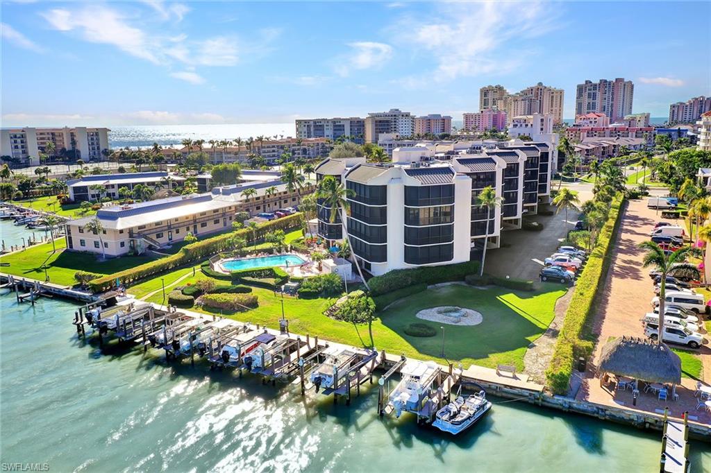 Rarely available, the Camelot Penthouse offers an exceptional combination of privacy, space and spectacular wide-water views overlooking Caxambas Bay. From its coveted top-floor position, enjoy an ever-changing panorama of sparkling water, passing boats and marine activity, with expansive views stretching toward the Gulf and Ten Thousand Islands. This spacious three-bedroom, two-bath residence offers over 2,000 square feet of living area, high ceilings and an abundance of natural light, with multiple balconies creating wonderful opportunities to relax, entertain and take in the views. The generous primary suite features custom closets and balcony access, while the spacious kitchen offers custom cabinetry, granite countertops, stainless steel appliances and an inviting bar/sitting area. Electric hurricane shutters provide extra peace of mind. Camelot is an intimate, low-density waterfront community on Marco Island's desirable south end, offering direct Gulf access with no bridges, boat docks available for lease, a waterfront pool and spa, a rooftop terrace, covered parking and extra storage. Just minutes from the beach, dining and shopping. A real gem in Paradise.