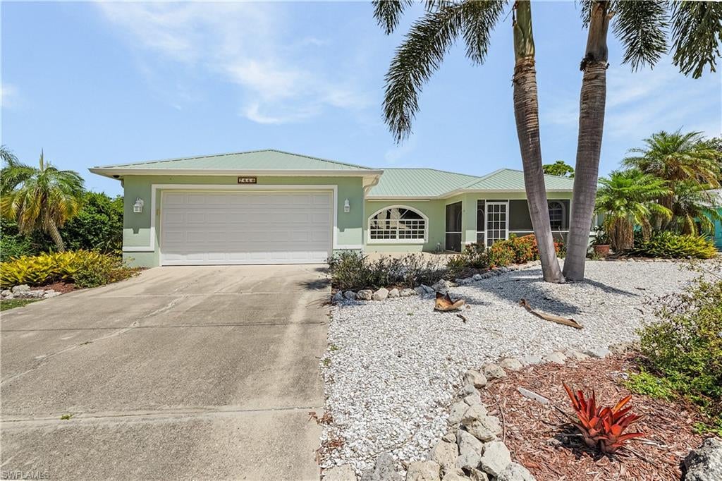 Paradise awaits in this spacious, beautifully maintained pool home nestled on a private .344-acre lot in desirable Alden Pines, Bokeelia. Built in 1999 with concrete stucco CBS construction, this move-in-ready residence offers 1,981 sq. ft. of living space and 2,422 sq. ft. total area, with an inviting open-concept design, cathedral ceilings, and a desirable split-bedroom floor plan.
Enter through the screened porch and double-door entry into a bright, spacious living and dining area. Triple sliding glass doors seamlessly open to the expansive screened lanai and pool, creating the ideal setting for entertaining or relaxing year-round.
The generous eat-in kitchen features updated granite countertops, a double sink, abundant cabinetry, and a walk-in pantry with extensive shelving. French doors provide direct access to the lanai and pool, making outdoor dining and entertaining effortless.
The private primary suite is a true retreat, complete with French doors opening to the lanai and pool, his-and-hers walk-in closets, and a spacious ensuite bath. The primary bathroom offers a large walk-in shower, dual-sink vanity, window seat, and separate toilet closet.

Two additional bedrooms feature large closets and share a full guest bath with a convenient pocket door that can close off the bathroom for added guest privacy. Additional interior storage includes a hallway closet and linen closet.
Outdoor living is where this home truly shines. The expansive screened lanai includes a half bath and storage closet, while the large, private backyard borders a peaceful mango orchard. Enjoy the Florida lifestyle with plenty of room to relax, entertain, and enjoy the pool.
Additional features include a new metal roof installed in 2023 with Ultra Rib panels and a Four Point Inspection Certificate, storm security shutters, tinted windows throughout, tile flooring in the main living areas, laminate flooring in the primary bedroom, PEX plumbing, and an in-wall pest control system. The oversized two-car garage includes attic storage, a work area, and laundry sink. The separate laundry room offers two spacious storage closets. The pool was resurfaced in 2014.
The home is 9' elevation certified and has never flooded. A voluntary HOA provides added flexibility.
Enjoy easy access to Pineland Marina and Tarpon Lodge, with dining, boating, and waterfront recreation just a walk or short golf-cart ride away. The newly renovated golf course and clubhouse are scheduled to reopen in late Fall 2026, adding even more appeal to this already exceptional location.
This rare turnkey pool home offers the perfect combination of privacy, comfort, outdoor living, and island lifestyle. Come discover your own piece of Florida paradise in Bokeelia!