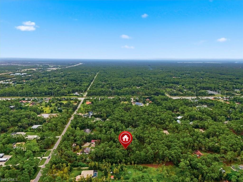 COLLIER WOODS ACREAGE! READY TO BUILD NOW! Discover the opportunity to own 2.5 acres in the highly desirable Collier Woods area. Tucked away at the end of a private driveway, this property offers the space, privacy, and flexibility to create the Southwest Florida estate you've been envisioning. This lot is already permitted for a 4000+ sq ft home, and ready to build, immediately. With the groundwork already in place, this property offers a unique opportunity to own a 2.5 square acre lot, in a prime location, where you can build immediately. Enjoy the best of both worlds, seclusion and acreage while remaining conveniently located to the amenities, shopping, dining, beaches, and attractions that make Naples one of Southwest Florida's most sought-after destinations. Whether you're looking to build a private estate or secure a premium piece of land for the future, this 2.5-acre parcel offers a rare opportunity in Collier Woods.