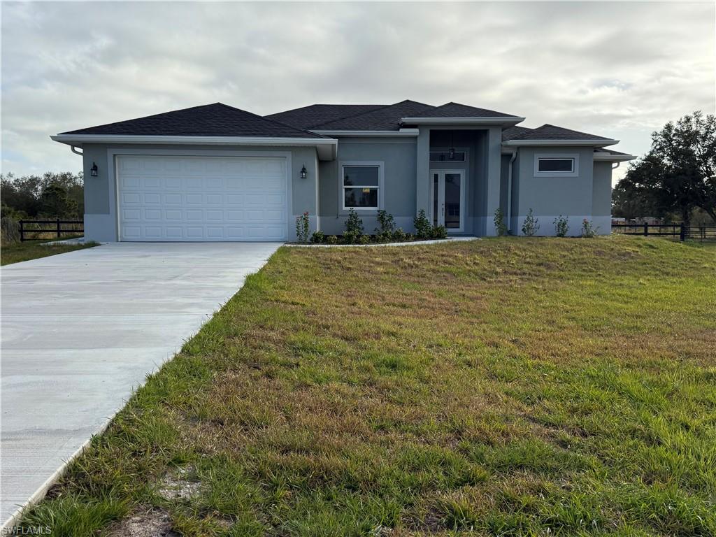 Enjoy peaceful country living in Montura Ranch Estates! This brand-new construction home offers modern finishes and an open, airy layout filled with natural light. Tile flooring runs throughout, and the stylish kitchen features quartz countertops, white cabinetry, and a stainless-steel appliance package—perfect for everyday living and entertaining.

The spacious owner’s suite includes dual walk-in closets and a beautifully finished bath with double sinks and quartz counters. Step outside to a large lanai ideal for relaxing and enjoying Florida sunsets. Built with impact windows and doors and equipped with a 60-gallon water heater for added efficiency and peace of mind.

Conveniently located with easy access to LaBelle, Fort Myers, and Miami, this home offers the perfect balance of privacy and accessibility.