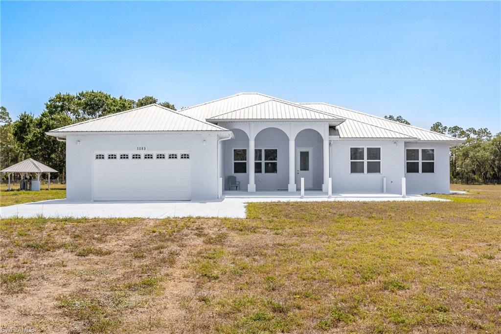 LIFE HAS ITS MANY REWARDS, ONE OF THEM IS RIGHT HERE WITH THIS 4 BEDROOM CUSTOM BUILT HOME ON 4.85 ACRES IN GLADES COUNTY! Located down a tranquil, dead end, paved road in Glades County you will find this easy to love floorplan that came with a careful thought process. Upgraded building products were used to give the homeowner peace of mind. High 10', 12' and 13' ceilings throughout along with 8' doors and abundant windows allow for plenty of natural lighting. Step through the back French doors to a massive, under truss, screened lanai built with study 14-gauge steel. The possibilities are endless with this party area, dance area or even a skating rink.  Nothing was overlooked with this beautiful offering. Outdoors on this completely fenced acreage you will find a 45' container, perfect for storage of your toys and yard equipment. One Bathroom is completed very nicely, The master bathroom has been plumbed for a tub but it is not installed, also there are no vanities. The bathroom on the opposite side of the home still needs vanities, finish these off to your own style. This home is being Sold As IS, Come and see for yourself and enjoy a peaceful lifestyle that you have been dreaming of!