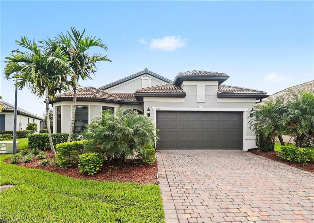 “Grove on the Green” sits in the gated Country Club section of River Hall and is sold with a transferable golf membership and the full club life that comes with it: the 18-hole Davis Love III CHAMPIONSHIP GOLF COURSE, his first design in Florida, the Bunker Bar, the Caloosa Grill restaurant, a resort-style pool, bocce, tennis, a pro shop, a driving range, and a huge exercise facility. The layout is open and airy: 3 nice-sized bedrooms, a huge chef’s kitchen, and a rare sunroom off the back with remote-controlled shades. The primary en-suite delivers an enormous closet, a seamless shower door, and medicine cabinets. The upgrades run throughout: impact doors and windows, crown molding and beefy baseboards, extra can lighting, designer lighting, and tile flooring everywhere, NO CARPET. The TANDEM GARAGE is the workhorse: oversized and large enough to park 3 vehicles, with additional golf cart parking that doubles as extra storage or a garage fridge spot, EXPOXY FLOORING, and overhead storage racks. And the homesite is the quiet headline: a pie-shaped lot in a prime CUL-DE-SAC location, rare and private, with the covered back lanai overlooking the velvet grass of the 6th hole and the lake beyond.
