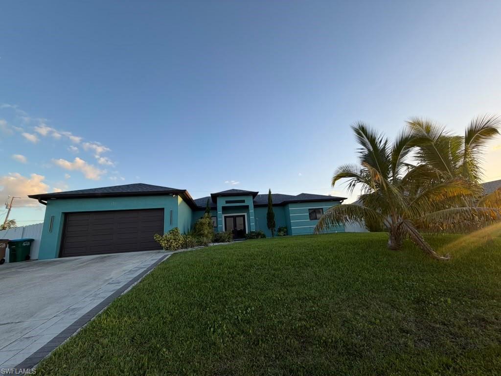 Beautifully maintained and showing like new, this 2020-built Cape Coral home offers 3 bedrooms plus a den, 2 bathrooms, and 1,392 square feet of living area. Its exceptional upkeep is evident throughout, with tile flooring in every room for a cohesive look and easy maintenance. The versatile den provides additional space for a home office or hobbies. Enjoy outdoor living on the lanai, complete with an outdoor kitchen, while the backyard features fruit trees and privacy fencing that fully encloses the yard. A spacious concrete walkway extends along one full side of the home, providing convenient access between the garage and backyard. With its like-new appearance, flexible living spaces, and inviting outdoor features, this home is ready to impress. Schedule your private showing today!