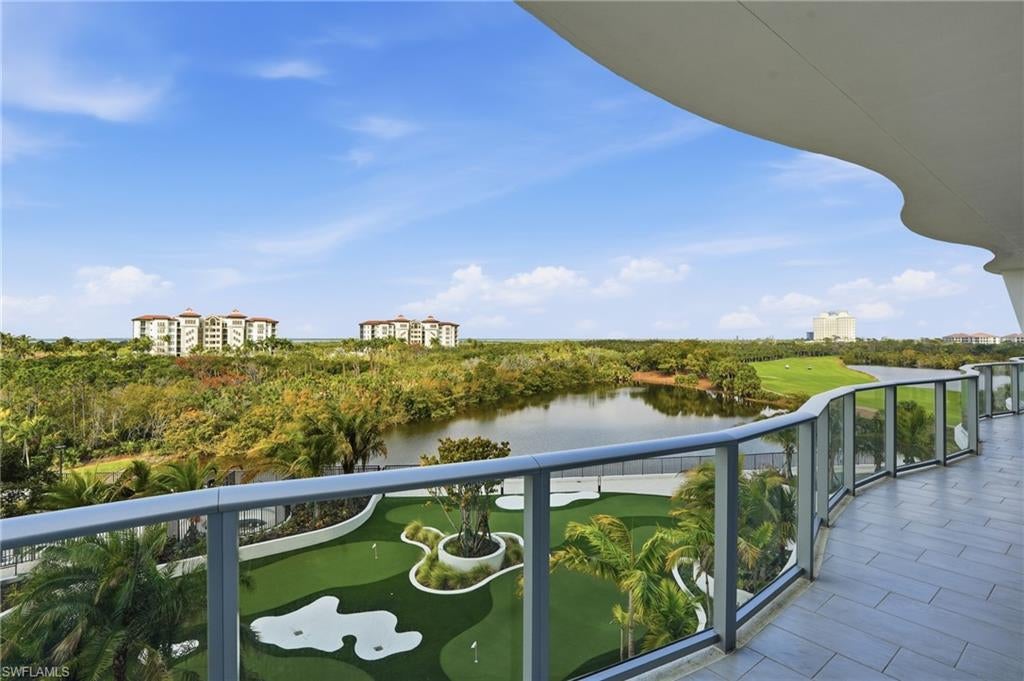 One or more photo(s) has been virtually staged, AI generated or rendered.  Welcome home to a brand-new coastal showpiece at Infinity at The Colony—where elevated design meets effortless, resort-caliber living. This refined residence captures a beautiful coastal outlook with tranquil water views framed through expansive glass, filling the interiors with natural light and an immediate sense of calm. Enter via your private elevator into a bright, contemporary sanctuary with soaring ceilings and an open layout designed for both intimate evenings and sophisticated entertaining. The chef-inspired kitchen anchors the home, flowing seamlessly into the living and dining spaces—each oriented to maximize the scenery and bring the outdoors in. Slide open the doors and step onto your oversized lanai, complete with a built-in grill—the perfect setting for morning coffee, alfresco dinners, and golden-hour moments with the breeze rolling in. A second private outdoor space adds even more room to unwind, host, and enjoy the relaxed rhythm of coastal living. Life at Infinity is a full-service experience—anchored by a standout collection of amenities designed for both indulgence and everyday ease. Spend your days among multiple resort-style pools, enjoy the convenience of a poolside restaurant, and gather effortlessly in the member’s lounge or game room. Wellness is elevated with a premier fitness center, while recreation takes center stage with pickleball courts and a PopStroke-style golf experience created by Tiger Woods’ architect—a truly unique offering in the luxury space. Even your four-legged family members are pampered with an on-site dog spa and dog park, and when the sun sets, the rooftop terrace invites unforgettable evenings with an outdoor kitchen and firepits—all complemented by 24-hour concierge service and access to The Colony’s private island beach park and the waterfront restaurant, the Bay Club. This isn’t just a residence—it’s luxury coastal living, perfected.
