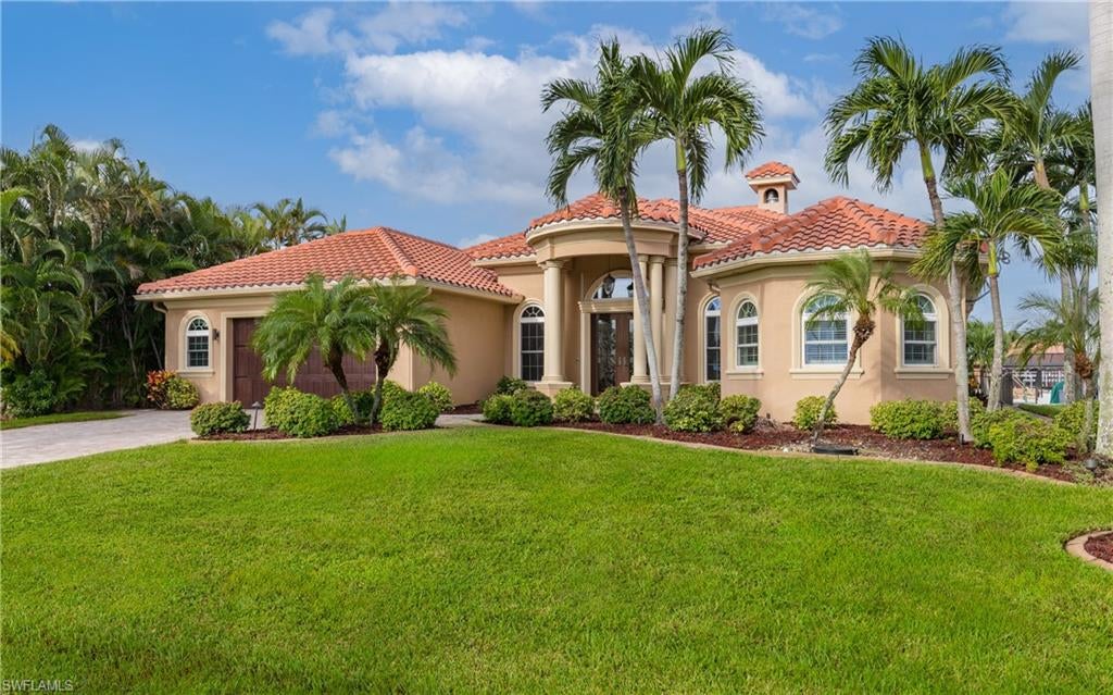 Enjoy waterfront living at 5426 SW 24th Place, where boating, poolside relaxation, and outdoor entertaining with a summer kitchen come together. Set along a Cape Coral canal with direct Gulf access, this home features an infinity pool overlooking the water and a tiki hut with a metal roof—the perfect setting for waterfront dining or unwinding after a day on the boat. Close to Cape Harbour, you’ll also enjoy convenient access to waterfront restaurants, bars, and entertainment.

Inside, a great room and separate family room provide versatile spaces for gathering, entertaining, or relaxing. The kitchen features granite countertops and a sleek bar top, offering an inviting place to prepare meals and connect with guests. Custom closets in the primary and secondary bedrooms add thoughtful storage throughout.

Tile roof, Kevlar hurricane screens, and exterior lighting. A 10,000-pound boat lift with canopy and a separate jet ski lift complete the waterfront amenities, keeping your next adventure close to home. From mornings by the canal to afternoons in the infinity pool, this property brings the Southwest Florida waterfront lifestyle to your doorstep.