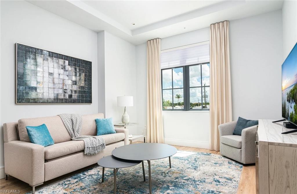 Unit 207 is a 1-bedroom, 1-bath luxury condo in Olde Naples. SoCe Flats is an exciting new condominium development in the most desirable neighborhood in Naples, the Paradise Coast's most coveted beach town. "SoCe", named for the ideal location South of Central Avenue in Olde Naples, offers the unique opportunity for a luxurious short-term vacation stay, walking distance to the beach and elegant 5th Ave S shopping and dining district. The building was designed by renowned local architect, MHK, and the interiors are decked out with finishes and furnishings selected by coastal contemporary design experts, Clive Daniel Home. Unit 207 has an open kitchen with sleek white quartz countertops and a counter height breakfast bar. The fully equipped kitchen has cookware, dishes, utensils and serve ware and there is a four seat dining table in case you ever decide to forego the fantastic restaurants within walking distance and eat in! The bedroom has a king size bed made up with crisp white linens and the living room has a sleeper sofa to accommodate a total of four guests. The bathroom is accessible from the living areas and has a full size front load washer and dryer for laundry convenience. There is one assigned covered parking space on the ground floor and additional public parking is available along 8th St S. Note, since this building is zoned for short term rental only, it does not receive USPS mail service and you will not have access to a mailbox during your stay. Onsite, the 18-unit building has a private open air amenity deck on the third floor which features an outdoor grilling area, lounge and dining seating with a TV. While there is no swimming pool or gym on site at SoCe, the Briggs Wellness Center is within walking distance and offers day passes for $12 which provides access to a large gym with cardio equipment and fitness classes, locker rooms with dry sauna and whirlpool, and an outdoor lap pool. SoCe is located along the growing "8th Street Corridor" in Olde Naples just three short blocks from 5th Ave S and eight blocks from beach access at the end of charming 1st Ave S. Many other conveniences are within walking distance such as Wynn's gourmet market and CVS. Designed to offer urban sophistication and amenities within a quaint beach town setting, SoCe Flats is an ideal place to enjoy the increasingly cosmopolitan Naples lifestyle!
