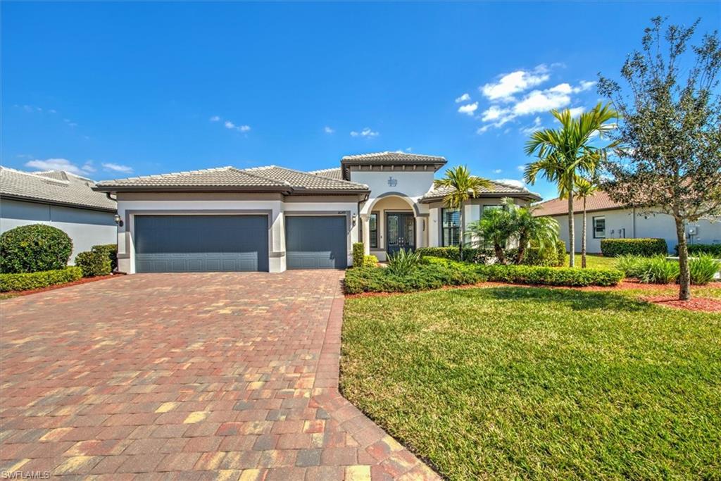 This pristine Pinnacle home in a gated country club community boasts an open floor plan with 2,488 sq. ft. of living space, featuring 3 bedrooms, 3 bathrooms, and a flex room with built-in desk and bookshelves. The kitchen stands out with its 10.5 ft quartz island, stone tile backsplash, motorized window shade and upgraded appliances. There’s abundant storage throughout. Plantation shutters, wood door, window casings, crown molding, additional cabinets and laundry tub in the laundry room and wall cabinets in all bathrooms. Lanai sports a heated saltwater pool with 40 ft of clear view screen cage and an above-ground heated HotSprings Jetsetter hot tub. The lanai includes a motorized hurricane screen, plus roll down hurricane screen for lanai windows, and zero corner sliders open to panoramic lake and 15th Fairway views—perfect for sunrises. The 3-car garage offers ample storage and a garden sink, all surrounded by attractive landscaping on a 70 ft lot. River Hall Country Club adds to the appeal with a top-tier 18-hole golf course and a 3-hole practice course. This home is a must-see!