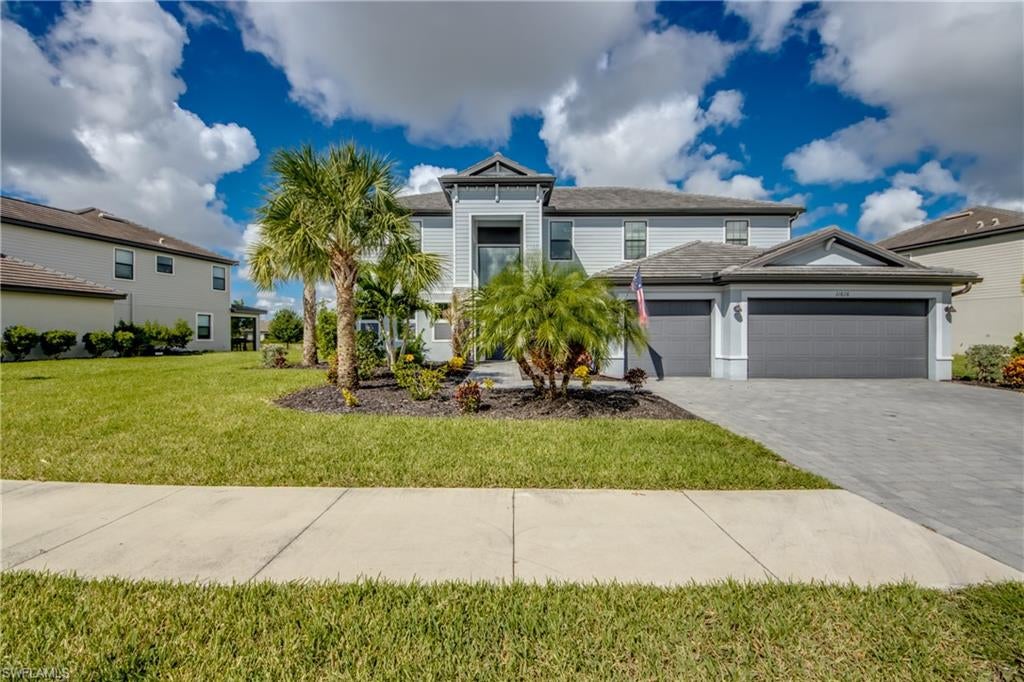 The Wynwood model in Timber Creek presents a rare opportunity to own a spacious estate home in one of Fort Myers’ premier guard-gated, resort-style communities. Offering approximately 3,945 square feet of living space, this two-story residence includes 5 bedrooms, 4.5 bathrooms, and a three-car garage that has insulated garage door and wall unit, highlighted by the convenience of dual owner’s suites—one on the first floor with vinyl flooring and another more luxurious suite upstairs both with large walk in showers and dual sinks. The first floor features soaring ceilings and French doors at the entry, a versatile den near the foyer, and an open living concept where the great room and kitchen seamlessly connect to a screened lanai through sliding doors. Tile flooring extends throughout the downstairs living areas, complemented by updated fixtures and fans that add a touch of elegance. Kitchen features stunning quartz countertops, G&E appliances like a double oven, cooktop surface, stainless steel sink. Everything in the kitchen is complemented perfectly with the mosaic backsplash on the bar and under the hood.  a The second floor offers three additional bedrooms and bathrooms, a spacious bonus room, and the second owner’s suite. Outdoor living is enhanced by a waterfront setting, a fully fenced backyard with ample space for a pool, and an expansive 60’ x 10’ screened lanai ideal for entertaining. Timber Creek itself offers 24-hour security and a wealth of amenities including a clubhouse, resort-style pools, fitness center, and proximity to JetBlue Park, making this home equally suited for family living and entertaining on a grand scale.
