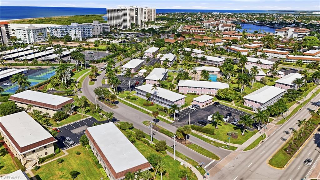 SEABREEZE SOUTH ON MARCO ISLAND | Minutes from the beach and surrounded by some of Marco Island’s favorite local spots, this updated 2-bedroom, 1-bath second-floor end unit is offered turnkey furnished and ready for effortless island living. Whether you’re looking for a full-time residence, seasonal retreat, or investment property, this low-maintenance condo combines a convenient central location with a bright, comfortable interior. 
Tile flooring runs throughout—no carpet—and the recently updated kitchen features crisp white cabinetry, modern granite countertops, stainless steel appliances, and a stylish backsplash. The updated bathroom offers a spacious glass-enclosed tiled shower and contemporary finishes, while the open living and dining areas provide an easy, relaxed layout for everyday living or entertaining. The furnished interior means you can arrive with little more than your toothbrush and start enjoying Marco Island right away. Best of all, the location makes it easy to leave the car behind. Marco Island’s Residents’ Beach is less than half a mile away, and popular nearby dining options include Sami's, Joey's Pizza & Pasta House and Doreen's Cup of Joe along the N Collier Blvd corridor. This community specifically highlights the property’s convenience to restaurants, retail, grocery shopping, pharmacies, and Marco Island’s world renowned beaches and amenities. 
Spend the morning with your favorite cup of coffee by the community pool, head to Marco Island’s Residents’ Beach for an afternoon by the Gulf, then enjoy dinner nearby without having to venture far from home. As a second-floor end unit, this residence also offers added privacy and an easygoing coastal feel. This is a move-in-ready opportunity to enjoy the Marco Island lifestyle.