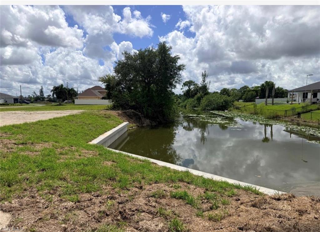 Exceptional opportunity to own an oversized freshwater canal homesite at 2004 NE 34th Ln in growing NE Cape Coral. Situated on a desirable corner at NE 34th Ln and Gator Circle, this approximately 0.50-acre double lot.
Major site improvements are already in place, including a newly installed 65-foot seawall and a fully cleared lot with no trees within the homesite. These completed improvements may provide the future owner with a valuable head start when planning a custom residence.
Freshwater canal frontage, intersecting canal views, and sought-after southwest rear exposure create an inviting setting for enjoying sunsets and the Southwest Florida outdoor lifestyle. The generous lot dimensions may accommodate a spacious custom home, pool, expansive lanai, outdoor kitchen, larger garage, and ample yard and entertaining space, subject to applicable zoning, permitting, setbacks, and City of Cape Coral approvals.

If you have been searching for a rare, oversized waterfront property with extra room, a corner location, and a seawall already in place, this homesite deserves your attention. Bring your builder and explore the possibilities at 2004 NE 34th Ln, Cape Coral, FL 33909.