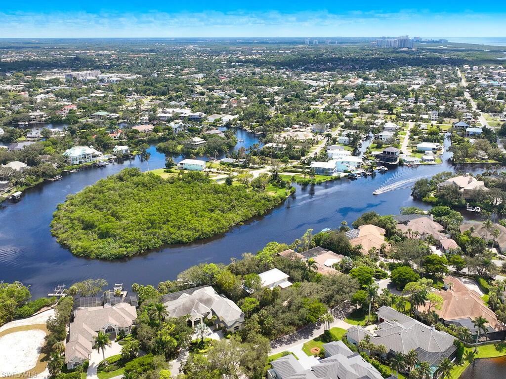 Enjoy the charm of this riverfront Old Florida inspired single family home built by Snell Construction, or take the opportunity to utilize this 0.53 acre homesite to construct the home of your dreams. A boat lift is permissible on this site. A most peaceful setting with the mangrove preserve across the river, owned by the Bonita Bay Community Association. Experience all that Bonita Bay offers with access to a private marina, newly rebuilt community beach facility, the finest club lifestyle available with the Bonita Bay Club’s dining, golf, tennis, pickleball, fitness and more.