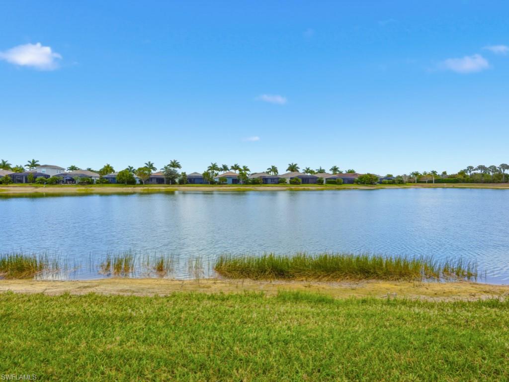 Lakeview tranquility from an immaculate 2 bedroom/2 bath villa with den in sought after Coral Harbor neighborhood. Open floor plan with an island kitchen, den and inside laundry room with 2 car garage. Master bedroom has new carpeting and two large closets, this opens up to an extra large master bath with dual sinks and walk in shower. Split bedrooms afford your guests privacy along with a multi use den/study. Watch the wildlife on the lake as the light filters into the home. Take comfort in the remote control electric hurricane shutters along with a hurricane screen on the lanai. Naples Reserve is a vibrant, amenity-rich community, residents enjoy access to 22 scenic lakes, a mile-long rowing lane, boat ramp, Island clubhouse, and fitness center. Social and recreational options abound with many events offered from our Activities Director. Bocce courts, beach volleyball, a brand new Reserve Club is open and offers a delicious menu from our Award Winning Chef. Swim or relax in a beautiful resort-style pool with lap lanes, sit by the fire pit, play beach volleyball; take an exercise class or a yoga class, it is all here for your enjoyment! Hop on the pontoon boat and enjoy a boat ride to our private Kon-Tiki island. The Outrigger has free bicycles, kayaks and the pontoon boat for your use.  Outdoor enthusiasts will appreciate paddle boarding, kayaking, tennis, pickleball, biking trails, various exercise classes, a two mile walking path around the development, two dog parks, a basketball court, and the Kid’s Cove playground a fishing area and much more. Ideally located between 5th Avenue and Marco Island, this exceptional home places you moments from, renowned shopping, dining, and breathtaking Gulf beaches. Enjoy all of the social amenities that Naples Reserve has to offer including tennis, pickleball and an abundance of events coinciding with the holidays including the holiday golf cart parade.  Many music programs on the weekend for your entertainment along with various card games and specialty groups. Naples Reserve has a full social calendar to keep you busy or you can just relax by the pool. Enjoy the Security of a Gated Community.