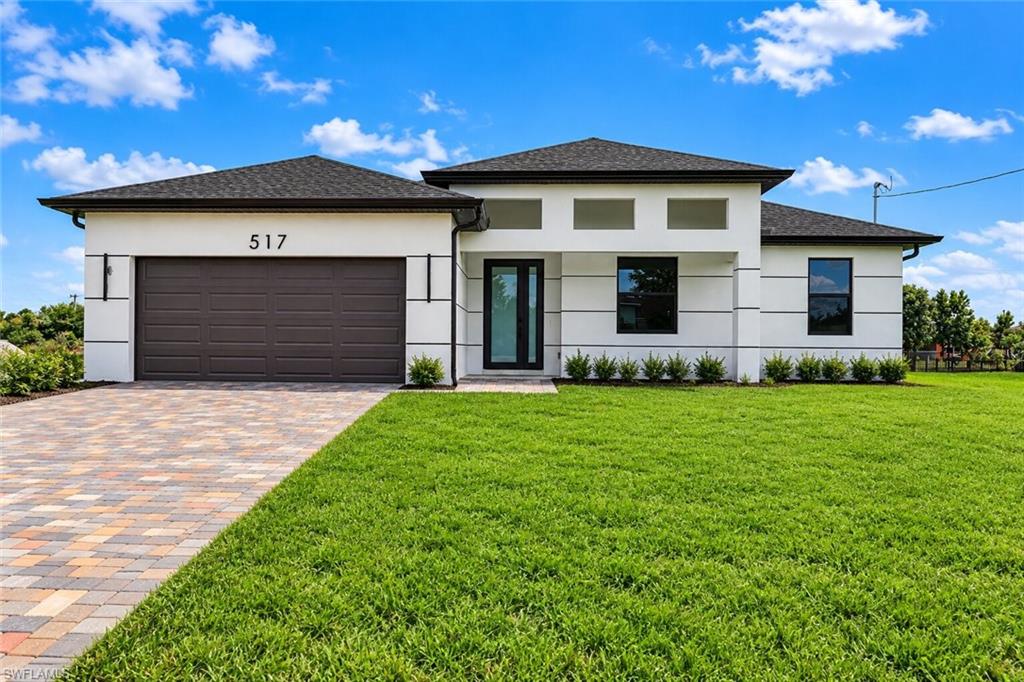 **SELLER OFFERING $10,000 TOWARDS BUYER'S CLOSING COSTS**BRAND-NEW CONSTRUCTION IN LEHIGH ACRES ON CANAL FOR ADDED PEACE AND PRIVACY – MODERN DESIGN & QUALITY FINISHES! Welcome to this beautifully designed 4-bedroom, 2-bathroom home offering the perfect combination of modern style, comfort, and functionality! Step inside to discover a bright and spacious open-concept floor plan, ideal for both everyday living and entertaining. The stunning kitchen serves as the heart of the home, featuring a spacious center island, sleek modern cabinetry, stylish finishes, and included appliances. Enjoy beautiful tile flooring throughout the main living areas, adding both elegance and easy maintenance. The generously sized primary suite offers a private retreat with a walk-in closet and an ensuite bathroom featuring dual sinks and a separate walk-in shower. Three additional bedrooms provide plenty of flexibility for family, guests, or a home office. Built with comfort and durability in mind, this home features IMPACT-RESISTANT WINDOWS AND DOORS, a spacious two-car garage, and a generous backyard with plenty of room to create your dream outdoor oasis or add a future pool! Conveniently located in a growing area of Lehigh Acres, with easy access to schools, shopping, restaurants, parks, and major roadways. NO NEED TO WAIT TO BUILD – ENJOY THE BENEFITS OF A BRAND-NEW HOME! Don't miss this incredible opportunity to own a beautiful new construction property in Southwest Florida. Schedule your private showing today!