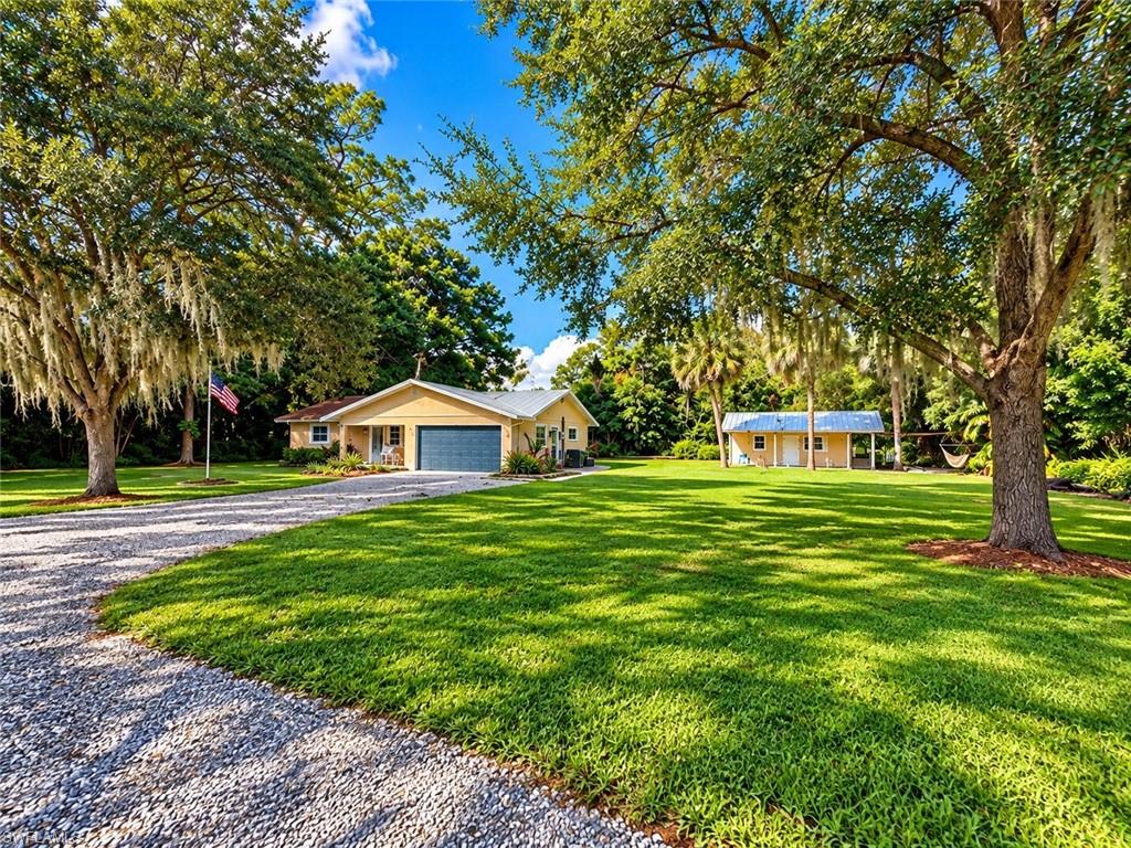 Space, privacy, and possibilities await at 2230 River Pine Drive! Tucked away on a private road and situated on an impressive 0.517-acre oversized lot, this property offers something increasingly hard to find in Fort Myers—room to spread out, enjoy the outdoors, and truly make a property your own.
Step inside and discover a home with generous and flexible living spaces, including a large additional room offering endless possibilities. Whether you envision a home office, den, hobby room, guest space, or future bedroom configuration, there is plenty of room to create a layout that works for your lifestyle. A spacious Florida room provides even more living and entertaining space.
Outside, the more-than-half-acre property really shines. Enjoy an open porch/lanai, plenty of yard space, covered parking, and a separate workshop/outbuilding—perfect for projects, storage, hobbies, recreational equipment, or creating your own backyard retreat. With this much land, there is room to enjoy the Florida lifestyle without feeling crowded by your neighbors.
Located on a private road with no gated-community lifestyle, yet convenient to shopping, dining, and everyday necessities, this property combines privacy and breathing room with accessibility.
If you've been searching for a home with land, flexible space, privacy, and incredible potential, this is one you'll want to see. Over half an acre in Fort Myers—bring your ideas and imagine the possibilities!