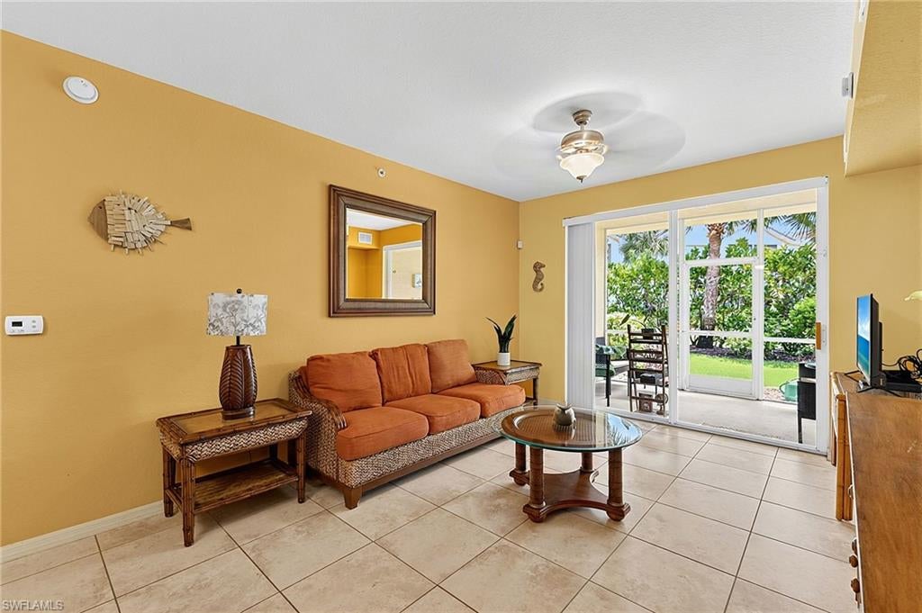 Located within the beautiful community of Villagio, this unit is just steps from the crystal clear pool with abundant guest parking and fruit trees throughout. This two-bedroom unit features tile and brand new luxury vinyl plank flooring, hurricane impact glass windows and sliders, and a screened-in lanai with calming views of the landscape. The kitchen is appointed with premium wood cabinetry and granite countertops. The owner's suite includes dual closets — one walk-in — dual sinks, and a large sized bathtub/shower. This unit is offered turnkey furnished and move-in ready, tastefully decorated with tropical decor, along with a brand new roof and freshly painted interior. Villagio is a gated community with resort-style amenities: multiple swimming pools, new pickleball and tennis courts, updated fitness center, private movie theater, ice cream bar, and a full-menu café open seven days a week. The monthly condo fee of $580 includes water, sewer, trash, premium cable with DVR, and high-speed internet. Tucked away in a highly desirable and ultra-convenient area of Estero, you are just moments away from wonderful schools, Miromar Outlets, local beaches, SWFL International Airport, I-75, dining, and entertainment.