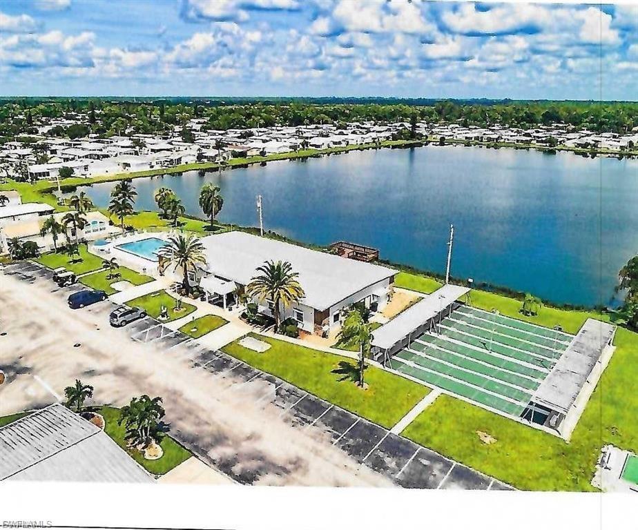 A 1987, ONE OF THE NEWER ONES ON THE MARKET. THIS IS A PALM HARBOR ENERGYMIZER MODEL IN GREAT CONDITION. ADDED HOME SURGE PROTECTOR BY LCEC. NEWER WINDOW METAL HURRICANE SHUTTERS, ROLLDOWN ELECTRIC SHUTTERS ON LANAI, NEW TIEDOWNS 2021, EXTRA TIEDOWNS ON CARPORT, TRANE A/C 10 YRS, HOT WATER TANK 7 YEARS. WINDOWS REPLACED BY PREVIOUS OWNER, NEW KITCHEN RANGE 1 YR., OTHER APPLIANCES REPLACED BY PREVIOUS OWNER, VAPOR BARRIER UPDATED, REPLUMBED, DOUBLE ROOFOVER ON HALF THE ROOF OVER SKYLIGHTS, LARGER ROOMS, 2/2 SPLIT BEDROOMS, OFFICE, NEWER MASTER BATH SINK/CABINET, NEWER SINK/FAUCETS IN GUEST BATH, NEW DINING ROOM LIGHT, NEWER KITCHEN FAUCET, DRIVEWAY PAINTED, LANDSCAPING UPDATED, ADT SECURITY ALARM SYSTEM AVAILABLE, EXTRA CABLE/INTERNET OUTLETS, UPDATED WINDOW COVERINGS, SERVING WINDOW KITCHEN TO DINING ROOM, LAMINATE FLOORS, IRRIGATION SYSTEM "AS IS" NOT USED BY SELLERS. OWN YOUR LAND, MAINT FEE 124.15/MO IS CONTROLLED BY CPI, NO LEASED LAND. LAKE, FISHING PIER, CLUBHOUSE, POOL, SPA, LOTS OF ACTIVITIES, GREAT PLACE TO LIVE. LOCATED IN LOVELY LAKE ARROWHEAD 55+ COMMUNITY. SORRY NO PETS ALLOWED IN THIS LOCATION. NOT IN A FLOOD ZONE PER COUNTY. CASH/CONVENTIONAL/FHA/VA. REALTOR OWNED PROPERTY. COME ENJOY THE SW FLORIDA SUNSHINE, MAKE NEW FRIENDS.