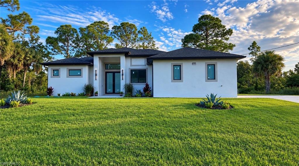 GREAT OPPORTUNITY! New construction 2026.Don’t miss the opportunity to buy the home of your dream in the city of Lehigh Acres,in a privileged location close to schools,shopping centers and just minutes from road 80 and I75.This beautiful home has a Modern architecture design and high ceilings.A spacious living surrounded by high impact windows and doors,wood kitchen cabinets with quartz countertop and new stainless steel appliances.Don’t wait any longer and make your appointment to see in person.
