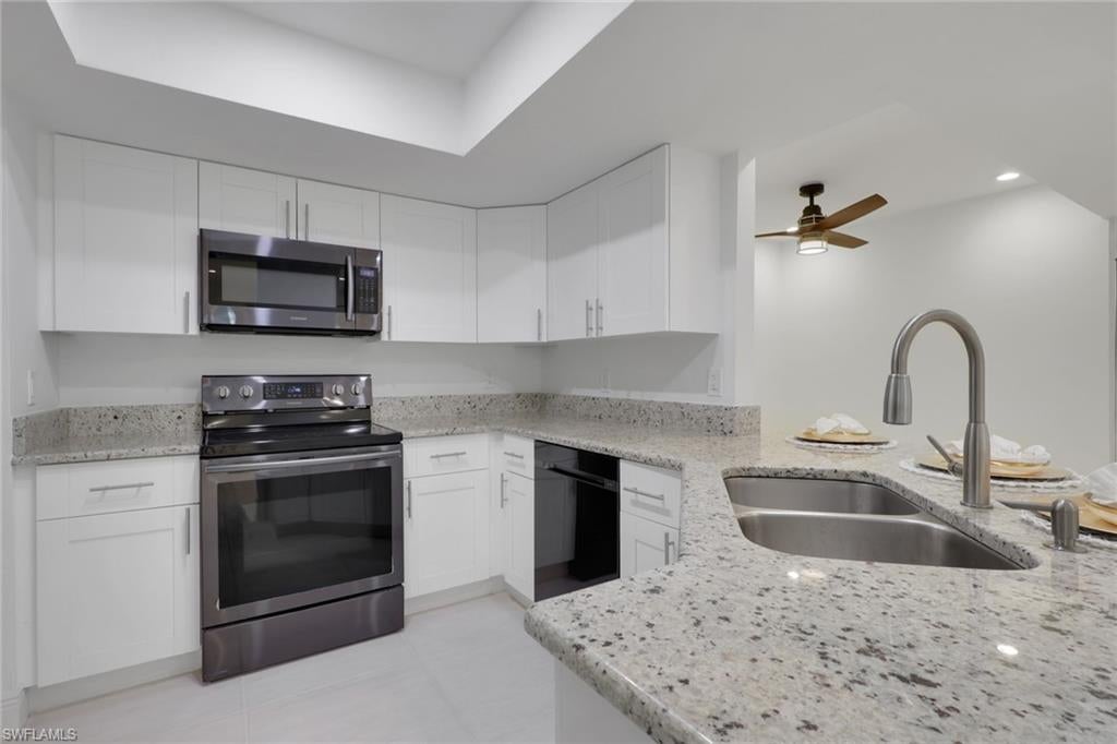 Completely updated 2 bedroom 2 bathroom condo in the conveniently located community the greens within fountain lakes. Screened in balcony overlooking a wooded area gives it a tranquil and private feel. Laundry room inside the unit right off of the kitchen with black stainless steel Samsung washer and dryer. A big plus and very little units have this feature are the brand new hurricane impact windows and sliders in the unit, huge update. Spacious with breakfast island, white shaker cabinets, granite counters and black stainless steel samsung appliances. Unit was recently painted and grout renewed throughout tile flooring. Both bathrooms have been updated with main bathroom offering a single vanity with walk in shower, and guest bathroom a shower tub combo with single vanity. Plumbing has been replaced to new standards. 
The greens at fountain lakes offers its own private pool area which is very close to this unit as well as tennis. The main club area at fountain lakes features a 9 hole golf course included in your hoa fees, as well as fitness room, another main club pool, pickle ball, tennis, basket ball, playground, grill area, shuffle board and bocce ball. Close to shops, restaurants, short commute to the airport and of course all the sandy beaches of SWFL