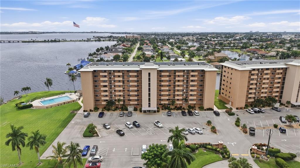 8TH-FLOOR END UNIT WITH RIVER VIEWS & RESORT-STYLE AMENITIES! Welcome to River Towers, a sought-after 55+ riverfront community where location, views, and an active Florida lifestyle come together. This exceptional 8th-floor end unit offers a level of privacy, natural light, and views that are rarely available. As an end unit, the additional windows bring in abundant natural light while providing more expansive views from the screened porch, creating the perfect place to relax and enjoy the beautiful Southwest Florida surroundings.

This 2-bedroom, 2-bathroom residence offers 1,065 square feet of comfortable living space and features impact windows and doors for added protection and peace of mind. The desirable southwest rear exposure provides wonderful afternoon and evening light, while the screened porch offers a relaxing outdoor space to take in the elevated views with the best seat in the house for the fireworks on July 4th.

River Towers is all about enjoying the Florida lifestyle, with an impressive array of amenities. Residents enjoy a large, heated riverfront swimming pool with a Tiki hut, community boat docks and a fishing pier, along with shuffleboard, horseshoes, billiards, ping pong, a library, and two social rooms, making it easy to stay active, socialize, and enjoy everything this vibrant community has to offer. The community boat docks are available on a first-come, first-served basis.

Additional features include a large ground floor storage room, one assigned parking space, and ample guest parking. River Towers is a 55+ community with no smoking and no pets, offering an environment for residents seeking a relaxed and active lifestyle.

The location is equally impressive. You are just minutes from downtown Cape Coral's restaurants, shopping, entertainment, and waterfront attractions, while Jaycee Park, the newly completed riverfront park, is just a short walk away.