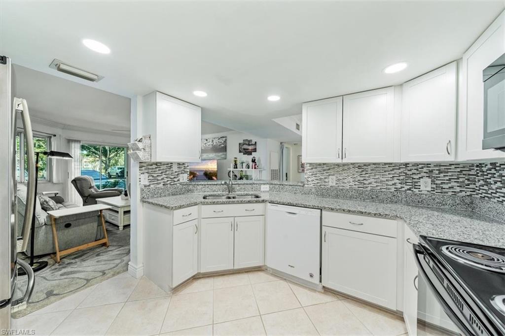 LOCATION, LOCATION! Close to FGCU, Coconut Point Mall, Miromar Outlets & Airport! This beautifully remodeled 2-bedroom, 2-bathroom END UNIT, located on the first floor, is sure to impress from the moment you arrive. The open-concept kitchen features a breakfast bar, granite countertops, and newer appliances. The spacious, flowing floor plan, with tile flooring throughout, is perfect for entertaining. Special touches include crown molding, remodeled walk-in showers with elegant tile walls and built-in benches (with handicap bars), new commodes, and granite vanities with sinks. The home also boasts new ceiling fans throughout, as well as newly replaced lanai screens. Storage is abundant with walk-in closets in both bedrooms, and a newer washer and dryer are included. Additionally, the electrical circuit breaker box was updated in 2021, and the water heater is approximately 4 years old. The A/C compressor is also about 3 years old. To enhance comfort, the seller has installed window and slider tinting to reduce sun glare. Relax and unwind on the spacious lanai with your favorite beverage. Fountain Lakes offers a wealth of amenities, including a 9-hole golf course, pickleball, tennis, a fitness center, a playground, a billiards room, a picnic area with grills, and a swimming pool. Plus, there's an additional pool at The Greens. What more could you ask for? Two pets are allowed with approval.