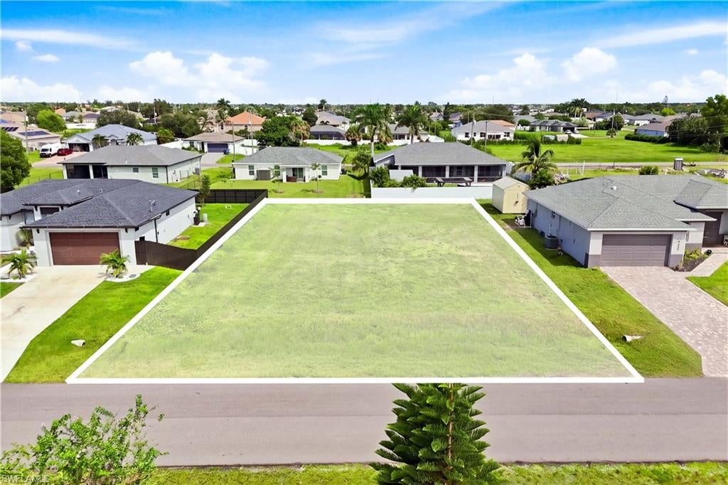 BUILD YOUR FLORIDA DREAM IN NW CAPE CORAL! Here is your opportunity to secure an approximately 0.23-acre residential homesite in an established and growing area of Northwest Cape Coral. With approximately 10,018 square feet, this property offers a blank canvas to design and build the home you have been envisioning.

Located on NW 4th Terrace, the property is surrounded by a mixture of established residences and newer construction, making it an attractive option whether you are planning your future Florida home, adding another property to your investment portfolio, or looking for your next building opportunity.

Enjoy the freedom of starting from the ground up and creating a home that fits your lifestyle rather than settling for someone else's choices. Cape Coral continues to offer the Southwest Florida lifestyle so many buyers are searching for, with shopping, dining, recreation and all that the area has to offer within reach.

Your piece of Southwest Florida is waiting—bring your plans, bring your builder, and imagine the possibilities!