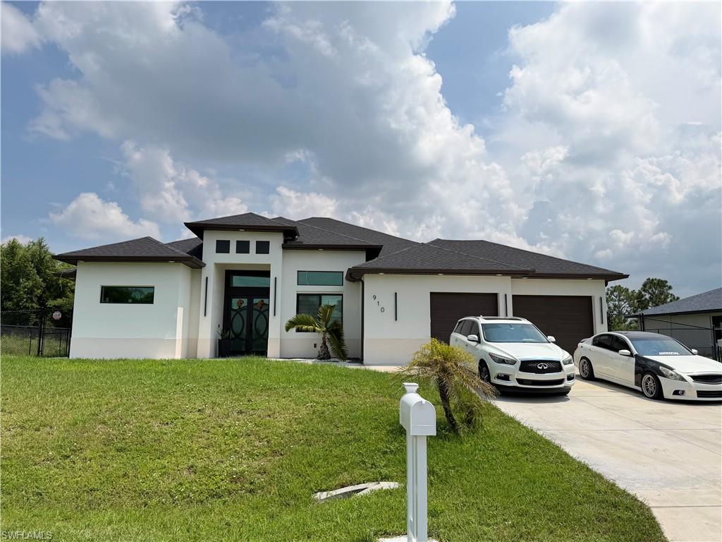 Welcome to this truly exceptional custom home in Lehigh Acres, FL 33971. Unlike anything else on the market, this one of a kind residence features 4 spacious bedrooms, 5 full bathrooms, soaring 12 foot ceilings with select areas reaching 14 feet, and luxury finishes throughout.
Step inside to a grand foyer, oversized floor tiles, beautiful chandeliers, modern lighting, and quartz countertops throughout. The custom kitchen is a showstopper, featuring a dedicated coffee bar, oversized microwave, touchscreen refrigerator, and beautiful modern finishes.
Every bedroom features a walk in closet and access to its own full bathroom. The primary suite is a true retreat with his and hers sinks and an oversized walk in shower with dual shower heads and glass doors.
Outside, enjoy a brand new in ground pool installed this year, a massive covered lanai, and a stainless steel outdoor kitchen complete with refrigerator, microwave, and gas stove, perfect for entertaining and family gatherings. There is also a full pool bathroom with a shower.
The property is fully fenced and includes a brand new storage shed and modern exterior lighting throughout. Custom built with incredible attention to detail, this is not your typical Lehigh Acres home. There is truly nothing else like it.


Bienvenido a esta espectacular residencia personalizada en Lehigh Acres, FL 33971. Una propiedad verdaderamente única que cuenta con 4 amplias habitaciones, 5 baños completos, techos de 12 pies y áreas que alcanzan hasta 14 pies de altura, además de acabados de lujo en cada rincón.
Desde la entrada encontrarás un impresionante recibidor, pisos de losas grandes, hermosas lámparas tipo chandelier, iluminación moderna y topes de cuarzo. La cocina personalizada es simplemente espectacular, con área de coffee bar, microondas de gran tamaño, refrigerador con pantalla táctil y elegantes acabados modernos.
Cada habitación cuenta con walk in closet y acceso a su propio baño completo. La habitación principal es un verdadero refugio, con lavamanos para él y para ella y una enorme ducha con dos cabezales y puertas de cristal.
En el exterior encontrarás una piscina completamente nueva, instalada este año, un enorme lanai techado y una cocina exterior de acero inoxidable equipada con refrigerador, microondas y estufa de gas, ideal para fiestas, reuniones familiares y días de piscina. También cuenta con un baño completo exterior con ducha.
La propiedad está completamente cercada e incluye un storage shed nuevo e iluminación moderna alrededor de toda la casa. Construida a la medida y con una increíble atención a cada detalle, esta no es una casa típica de Lehigh Acres. Realmente no hay otra igual.