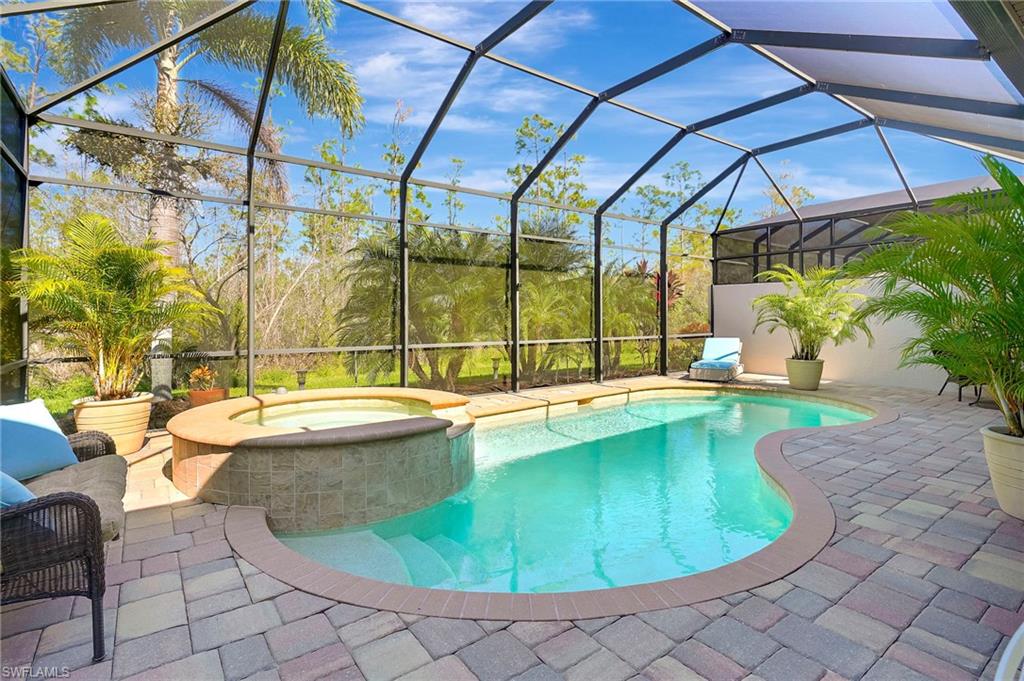 LISTING UPDATE: FURNISHINGS ARE INCLUDED WITH THE LIST PRICE!  Welcome to breathtaking Paseo, and this two-bed plus den, two-bath, attached twin villa with SALTWATER heated pool and SPA with water feature. The spacious covered lanai with pool is a private oasis overlooking tropical landscape and a protected preserve. This home offers an open living/kitchen concept with adjacent dining area, soft close 42” off-white cabinetry, primary bed ensuite with dual sinks, shower, separate tub and custom built-ins in primary closet, 10-foot ceilings with oversized 8-foot doors, granite throughout, and a two-car attached garage.  Additional features include hurricane rated windows and doors, easy touch indoor control panel for pool & spa, new lighting and fans, plantation shutters, new HVAC (2023), newer water heater (2022), water filtration system (filters replaced in 2025), Blink security system, LED recessed lighting, stainless steel appliances, and landscape lighting. HVAC includes a 10-year transferrable parts and labor warranty.  Exterior was painted and pavers were pressure washed in 2025. 

The Village Center at Paseo offers a vibrant lifestyle for all ages, with amenities and activities that cater to all ages. Enjoy a breathtaking resort-style pool complete with Tiki bar grill offering delicious food and a large variety of drinks and cocktails, a lap pool, hot tub, and a kiddie splash area. Amenities also include a fully equipped fitness center, spa and beauty salon, Pub, a Bistro offering upgrade event dining, library with Internet and an ample selection of books, six Har-Tru tennis courts, pickleball courts, bocce courts, and movie theater. All of this within minutes to I-75, Fort Myers International airport (RSW), great restaurants, supermarkets, beaches and all the services that you may need. Visit the community website at https://www.mypaseo.life to tour the fabulous amenities!