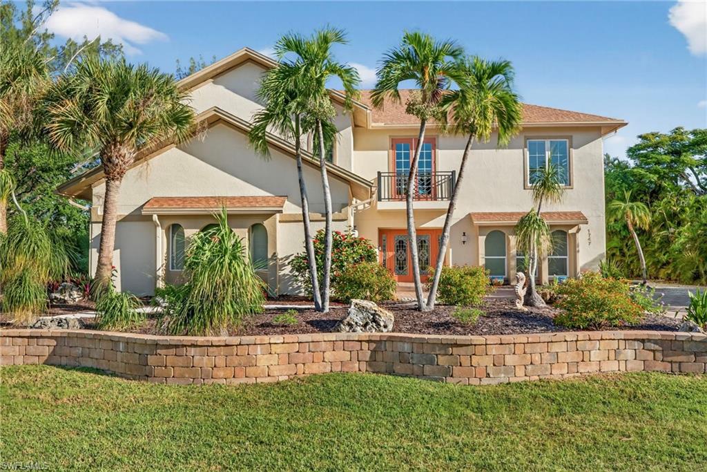 Originally built in 1975, this Sanibel gem has been completely reimagined and rebuilt from the ground up after Hurricane Ian — offering all the charm of classic island architecture with the comfort and efficiency of new construction. Thoughtfully designed atop the original structure, this home is truly brand new, featuring modern finishes, updated systems, and a fresh coastal aesthetic that blends seamlessly with its peaceful surroundings. Step inside to find bright, open living spaces filled with natural light, a contemporary kitchen with quality finishes, and inviting outdoor areas perfect for island living. Every detail has been refreshed — from flooring and fixtures to windows and mechanicals — giving you peace of mind and a move-in-ready experience. Located on quiet and aptly named Serenity Lane, this property offers a tranquil island lifestyle close to Sanibel’s world-famous beaches, bike paths, and shops. Whether you’re seeking a full-time residence or a relaxing retreat, 1747 Serenity is a rare opportunity to enjoy the best of new construction with timeless Sanibel character.