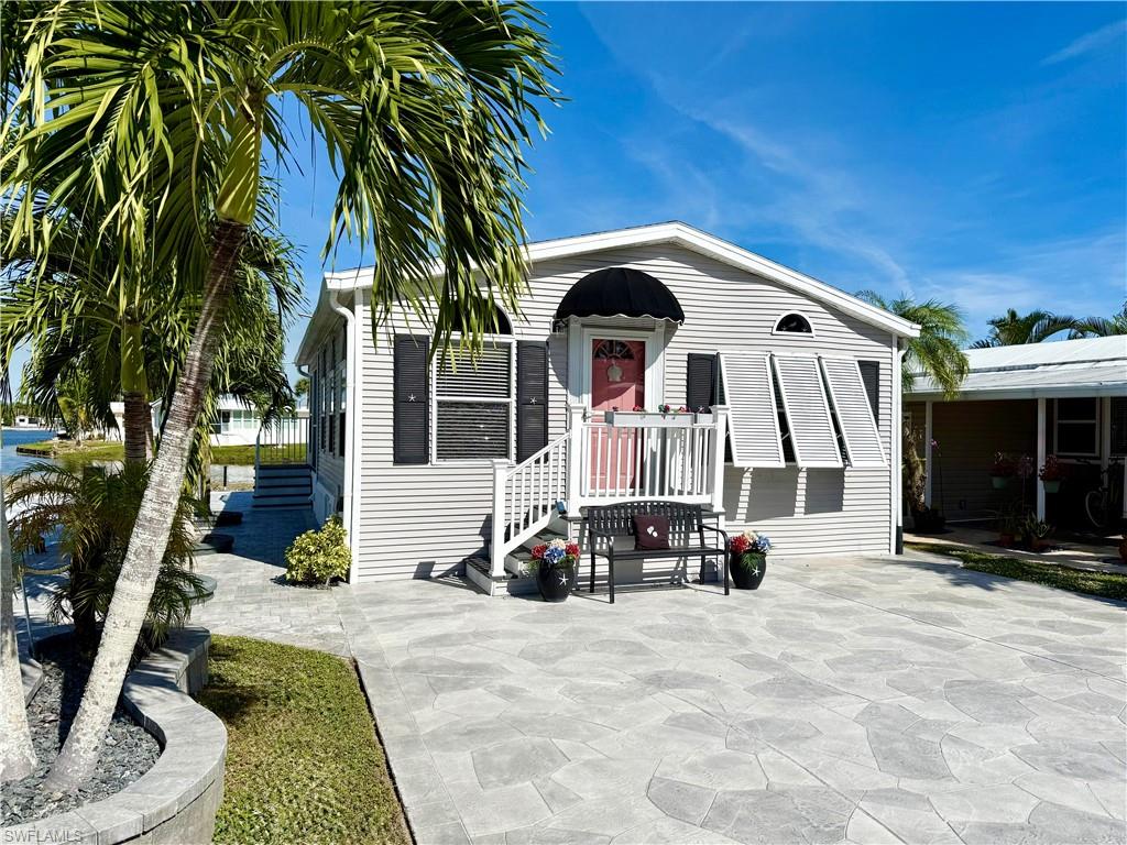 This is a home that has it all! There is no need for a list of “to dos” --- you can move right into this brilliantly maintained 1Br/1Ba home situated on the water! Thank you for viewing 504 Cheetah Drive in the Imperial Wilderness Condominium Association where YOU OWN THE LAND. It could be an understatement to declare that this home is meticulously maintained. Everything is clean and features many updates. Here are just a few examples: kitchen, bathroom, flooring, siding, lighting, hot water tank, and patio pavers. Visually, all elements flow creating a perfect aesthetic. A tropical and relaxing vibe is the essence of the interior, lanai, and exterior. Plus, IWCA is a gated and brilliantly located 55+ community in tropical Naples, FL. It is situated amid numerous restaurants and stores with easy highway and airport access (45-minute drive to Ft. Myers via I75). Beaches are also close-- 11 miles to the Naples beaches and 8 miles to Marco Island beaches. Very importantly, IWCA was never flooded and has not been affected by any recent hurricanes. Being that the home is sold furnished, makes it the perfect spot for seasonal, full-time, or rental purposes. The HOA fee of $898. per quarter covers many of your needs: water, lawn care, basic cable, trash/recycling, and community amenities. Beyond the security of a gated 55+ location, there are numerous community amenities: 2 pools with spas, a nature trail, pickleball, tennis, horseshoes, bocce, pétanque, memorial garden trail, 2 dog parks (there is a 1 pet, 40lb. max., restriction), and the ability to drive an electric golf cart within the park. On top of everything, IWCA offers a phenomenally active social events calendar.