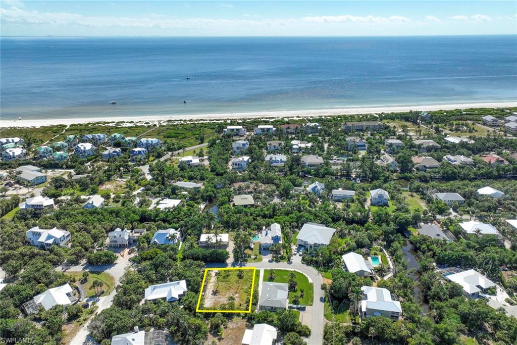 Create your ideal island retreat on this exceptional near-beach homesite, tucked away on a quiet private street just minutes from deeded access to the Gulf of Mexico. Ideally located on Sanibel’s sought-after east end, this property offers the perfect blend of privacy, convenience, and coastal charm — all just moments from the Causeway. Bring your vision to life and build the Sanibel home you’ve always imagined.