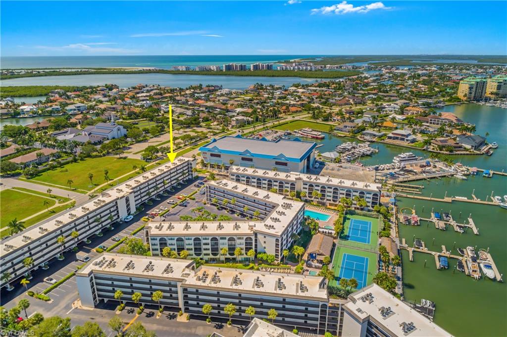 Rarely available 1-bedroom, 1-bath condo with a deeded covered parking space in the highly desirable waterfront community of Angler’s Cove. Angler’s Cove is known for its direct Gulf access in Factory Bay and host of resort-style amenities, including two heated pools, two spas, tennis courts, floating docks, waterfront restaurant, The Dolphin Tike Bar, and waterfront sunset seating just to name a few. This is the perfect condo whether  you are looking for a private tropical waterfront escape or a high-performing rental cash flow investment, this rare 7-day minimum rental policy provides an incredible opportunity for significant rental income year around. Experience hassle-free ownership with the low $720 monthly fee that also includes electricity, cable, water, and sewer. With a flexible 7-day minimum rental policy, this condo is ideal as a high-performing asset for investors or a perfect waterfront getaway. This unit has just went under a current refresh with new Impact windows and door, new air conditioner with UV sterilizer/air purifier built in, new Linoleum floors, freshly painted, new outdoor screen on lanai, new range and refrigerator, all new furniture and T.Vs, new ceiling fans. This unit really does have it all, the perfect place to call home, a weekend getaway, the perfect seasonal waterfront condo or one of the islands best invest opportunities available.