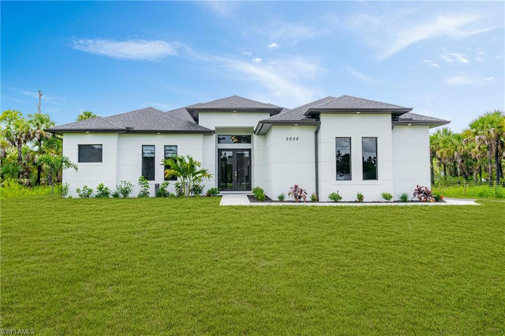 Welcome to this stunning new construction home built in 2025, located in the desirable Golden Gate Estates. Designed with a modern and elegant style, this residence offers the perfect blend of comfort, functionality, and quality finishes.
The home features 3 spacious bedrooms plus a den, ideal for a home office, study, or additional living space, along with 2.5 bathrooms. The open-concept layout provides abundant natural light and seamless flow throughout the living areas.
A standout feature is the fully finished outdoor kitchen, perfect for entertaining, family gatherings, and enjoying the Florida lifestyle year-round. As an added upgrade, the property includes modern zebra blinds installed on all doors and windows, enhancing privacy, light control, and contemporary appeal. This is a rare opportunity to own a move-in-ready, modern home in one of Naples’ fastest-growing and most peaceful communities.