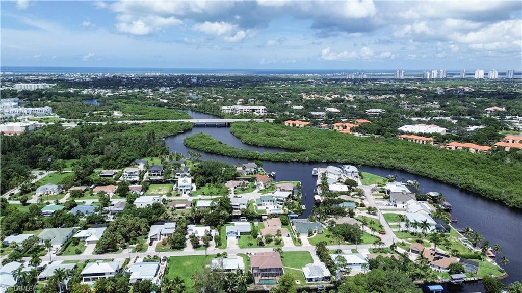 One or more photo(s) has been virtually staged, AI generated or rendered.  Build your dream home on this direct Gulf-access lot in the desirable Pirate’s Cove neighborhood of Bonita Springs! Just minutes to the Imperial River and the Gulf of Mexico, this location is perfect for boating enthusiasts and those who want to live the true Florida lifestyle. Gulf access via private canal and Imperial River, impact fees already paid — big savings for the new owner, rip rap already installed at shoreline for erosion protection, quiet, established neighborhood with no HOA restrictions, central location: close to Barefoot Beach, Bonita Beach Road, shopping, dining, and I-75. Just blocks from the newly revived downtown Bonita Springs, with almost weekly activities at the bandshell including art shows, live music, and community events. Utilities available at the street! This property is cleared and ready for your vision. Whether you’re looking to build a seasonal getaway or a full-time residence, this is a rare opportunity to own Gulf-access land in Bonita Springs!