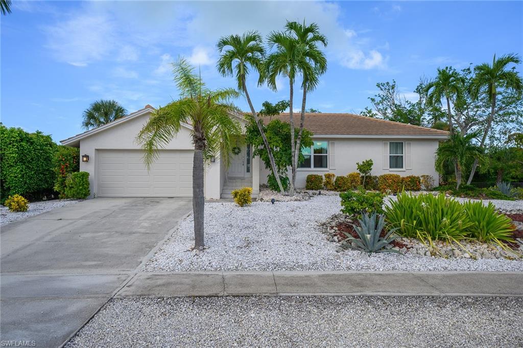 The one that is move-in ready and ideally situated. Welcome to 770 Kendall Drive, a beautifully updated residence in one of Marco Island's most desirable neighborhoods that truly defines the term ''Easy Living''. This bright and airy 3 bedroom home features a newer flat tile roof (2021), new impact windows and doors (2025) and newer AC unit (2024) for peace of mind and energy efficiency. This property features consistent tile flooring throughout, making it easy to clean and match your own personal touches of decor. Enjoy the convenience of low maintenance and low cost xeriscape landscaping, and a spacious yard with plenty of room for a pool. The tiled, screened lanai is perfectly situated to relax and enjoy the legendary Marco Island sunsets. Inside, the open layout is perfect for relaxed Florida living. Located in the exclusive Tigertail area, you're just moments from pristine beaches, shopping, and excellent restaurants. The boxes have all been checked for location, windows, doors, roof, floors and more. It really can be that easy!