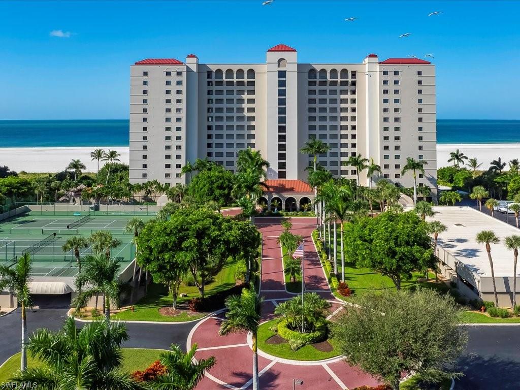 Imagine a recently renovated spacious 2 bedroom upper floor residence with westerly sunset views every day and full beach views from Tigertail/Hideaway beach to Cape Marco. Cheerful, clean, inviting, captivating. This is what you’re looking for – move in ready, already renovated and updated, furnished in modern style. Large living room overlooks the beach and features balcony with electric roll down storm shutters for easy use when you leave.  Walk in showers in each bathroom, dual sinks in main bath, residence laundry, accent lighting, excellent kitchen design, impact windows.   One of the most photogenic properties on the beach, the Crescent Beach condominium offers an extensive dignified palm lined entry drive, undercover parking of course, extra spacious sun deck around the heated pool, beach boardwalk, fitness room, and secure entry to the building. The Association is in excellent financial shape, the building in updated condition to meet today’s rigorous safety & structural standards, the management proven over many years