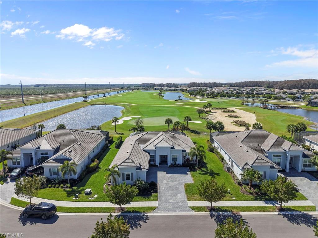 An unbelievable opportunity for turnkey estate living with bundled golf and beautiful fairway views in The National Golf & Country Club at Ave Maria. Built in 2023, this fully furnished Napoli II even includes a brand-new golf cart—just bring your clubs and start enjoying the lifestyle!

Offering 2,395 square feet, this thoughtfully designed split-bedroom floor plan features three bedrooms, a den and 2.5 baths. The open-concept kitchen is made for entertaining, showcasing an oversized island, high-end appliances and three refrigerators. A formal dining area and breakfast nook flow seamlessly into the spacious great room and out to the screened lanai.

Perfectly positioned on a quiet cul-de-sac overlooking the 16th fairway, the home enjoys desirable southwest exposure, endless sunset views and a location just seconds from the Pro Shop. The outdoor living area features a heated pool and spa, electric storm screen, Blackstone griddle and gas grill—everything you need to relax or entertain year-round.

The private owner’s suite offers an expansive walk-in closet and a spa-inspired bath with a separate soaking tub and walk-in shower. Additional highlights include plank tile flooring, a neutral color palette, laundry room with utility sink, convenient cabana bath and a whole-home surge protector to safeguard appliances and electronics. The oversized three-car garage provides plenty of room for vehicles, storage and the included golf cart. A paver driveway and beautifully maintained landscaping complete the home’s impressive curb appeal.

Deeded golf membership is included at The National, featuring a Gordon Lewis-designed 18-hole championship course. Residents also enjoy a resort-style zero-entry pool, state-of-the-art fitness center with sauna, full-service spa, tennis and pickleball courts, and an elegant clubhouse with indoor and outdoor dining. Nearby Ave Maria Town Center and Naples provide even more shopping, dining and entertainment options.

Turnkey, bundled golf, fairway views, a private pool and spa, and a new golf cart!