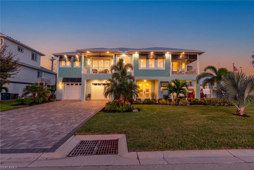Imagine calling this extraordinary property home! Built in 2023, this stunning custom residence leaves little to the imagination. From gorgeous bay views to impeccable craftsmanship and exquisite designer details, this is a home that truly must be seen to be appreciated.
Every inch of this remarkable property reflects thoughtful planning, exceptional quality, and an unwavering attention to detail. The interior showcases spectacular lighting, luxurious spa-inspired baths, and a beautifully designed kitchen featuring exquisite custom cabinetry, an exceptional layout, and breathtaking bay views. Designer touches are found throughout, thanks to the talented decorator whose vision brings elegance and sophistication to every space. The builder’s workmanship is equally impressive, with quality and craftsmanship evident in every detail.
Beyond its stunning living spaces, this home offers an abundance of versatility, including a huge garage and workshop area, bonus rooms, and extensive storage. The large corner lot provides even more possibilities, while the thoughtfully designed indoor and outdoor spaces create exceptional opportunities for entertaining, relaxing, and enjoying the coastal lifestyle.
This is more than a beautiful home; it is the realization of a dream. When years of envisioning the perfect home come together with meticulous design, exceptional craftsmanship, and luxurious finishes, the result is something truly special. With delightful surprises around every corner, this residence is sure to impress even the most discerning buyer.
And then there is the location! Enjoy the best of Fort Myers Beach living with convenient, walkable access to the beach, restaurants, entertainment venues, shops, and the many attractions that make this resort destination so desirable. Ideally situated to enjoy the vibrant coastal lifestyle while avoiding much of the seasonal traffic, this home offers a wonderful balance of convenience, comfort, and luxury.