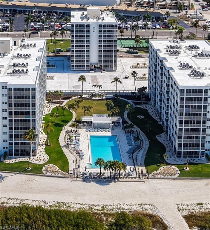 NOTE:  Seller Motivated-will pay first 3 Months Association Fee.  ANOTHER reduction of $10,000 after the HUGE $50,000 Reduction in Price.  Right on the BEACH!  Move right into this two-bedroom, two full bath, absolutely beautifully decorated turnkey home.  Located at the South End of Fort Myers Beach. Right across the street from Santini Plaza and CVS which makes your life easier when wanting to dine out, do some clothes shopping or enjoy the Farmer's Market.  As you look at the pictures you will see the warm and welcoming home this will be.  Seller has, also for your comfort, INSTALLED NEW Hurricane Sliders inside and also Sliders on the Lanai for further protection from rain and wind so you can sit on the Lanai and enjoy the views.  New GFI's and Light switches have been installed.  When you're ready to enjoy the Pool or the Beach, it's just a few steps away.  The Landscaping around the Condo and pool is all new.  You can also enjoy a game of Tennis, or Pickle Ball, on the new court.  Not only is there a heated pool that you can relax and look at the beautiful Gulf, but it is also keyed for residents only.  There is also an Exercise room, a Social Room and an Activity Calendar to keep you busy and meet the great residents of Creciente.  A Grilling area is also available to residents.