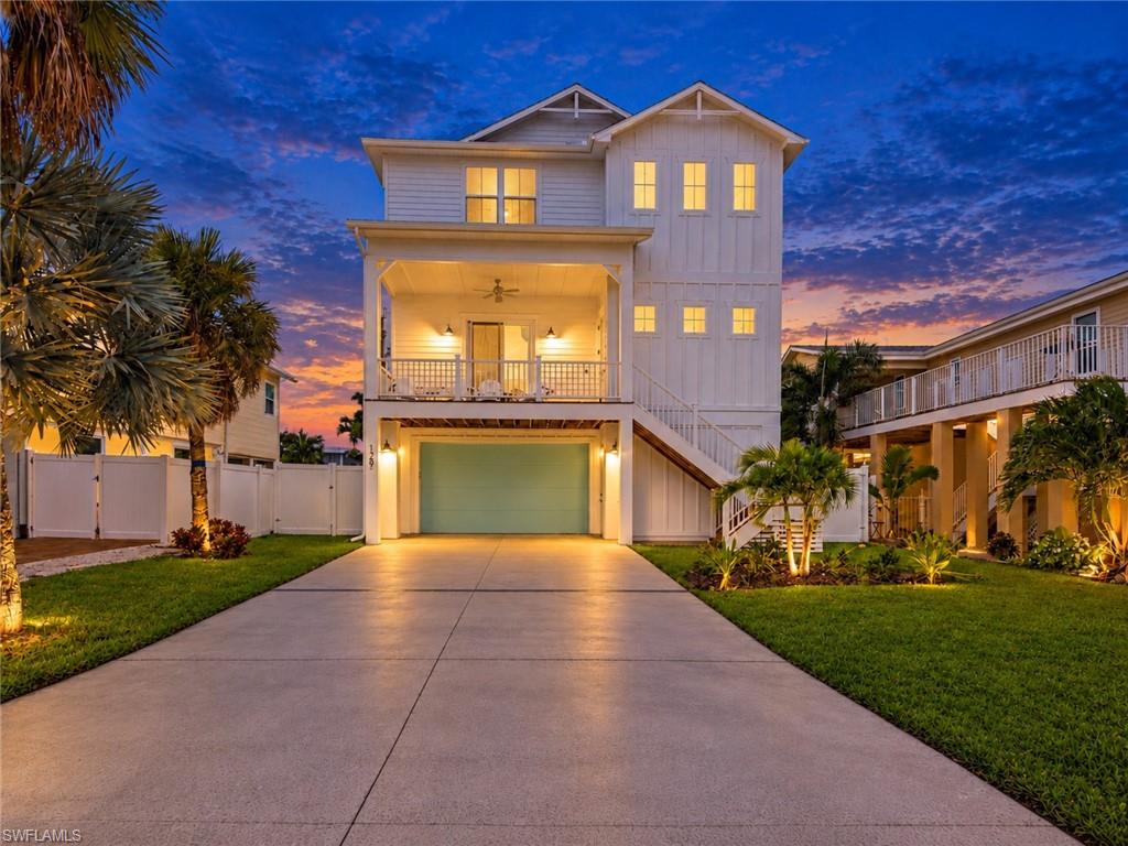 One or more photo(s) has been virtually staged, AI generated or rendered.  2025 NEW CONSTRUCTION — WEEKLY RENTAL INVESTMENT OPPORTUNITY! This elevated Fort Myers Beach home is professionally designed and beautifully furnished, offering 5 bedrooms, including 3 private en suites, and 4.5 bathrooms. Every room has its own touch of paradise, creating a unique coastal experience 
The open-concept main living area features beautiful Gulf views, modern coastal finishes, and plenty of space for entertaining. The primary suite also offers Gulf views, creating the perfect private retreat.
Outside, enjoy a private pool, outdoor shower, expansive ground-level entertainment area, and a white-fenced backyard offering added privacy. The home also includes a spacious 2-car garage.
Ideally located just steps from DiamondHead Beach Resort and within walking distance of Times Square, the beach, Margaritaville Resort, restaurants, shopping, and entertainment. Whether used as a high-demand weekly vacation rental or a private beach getaway, this turnkey home offers an incredible opportunity in the heart of Fort Myers Beach.