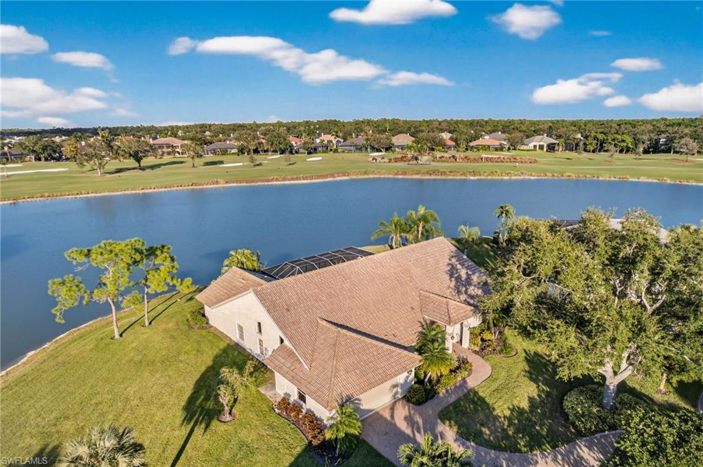 Exquisite lakefront estate on an oversized cul-de-sac lot in the prestigious Valley Oak enclave of The Vineyards. This impeccably renovated home boasts soaring ceilings, sweeping lake views from nearly every window, an oversized 2-car garage, and a brand-new 2026 pool and spa renovation, offering an unparalleled combination of elegance, privacy, and Florida lifestyle.The 2020 renovation features CoreTec luxury vinyl flooring, designer tile and lighting, and a chef-inspired kitchen with quartz and granite countertops, GE Café appliances including a 6-burner induction cooktop and French-door double oven, a Fisher & Paykel dishwasher drawer, oversized 32” sink, and custom storage throughout. Spa-inspired baths, plantation and Storm Smart electric shutters (2021), a new GE washer, and an epoxy-finished garage complete the home’s thoughtful upgrades. Set against a serene lake backdrop, this residence offers effortless indoor-outdoor living with access to lush landscaping, walking paths, and optional world-class golf, tennis, wellness, and dining—just minutes from Naples’ beaches, shopping, and fine dining.